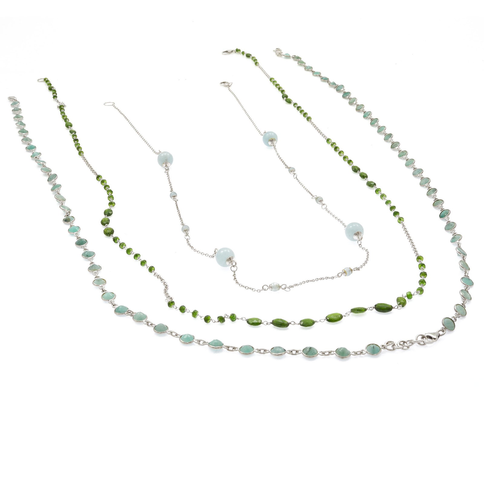 Collection of Emerald, Aquamarine, Chrome Diopside: Including sixty-two round-cut emeralds, each measuring approximately 6.0 to 5.8 mm, joined by sterling silver chain, forming a 35 inch necklace; four round aquamarine beads measuring approximately 10.