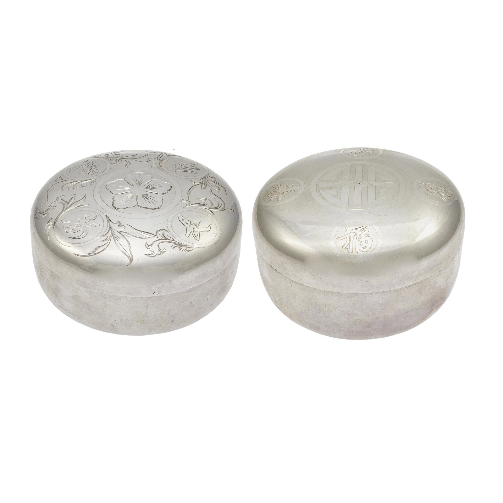 Two Japanese Silver Boxes and Covers, 20th Century: Each of compressed circular form and decorated with auspicious characters to the cover. Diameter: 4 1/16 inches (2) Total weight: 15 ounces
