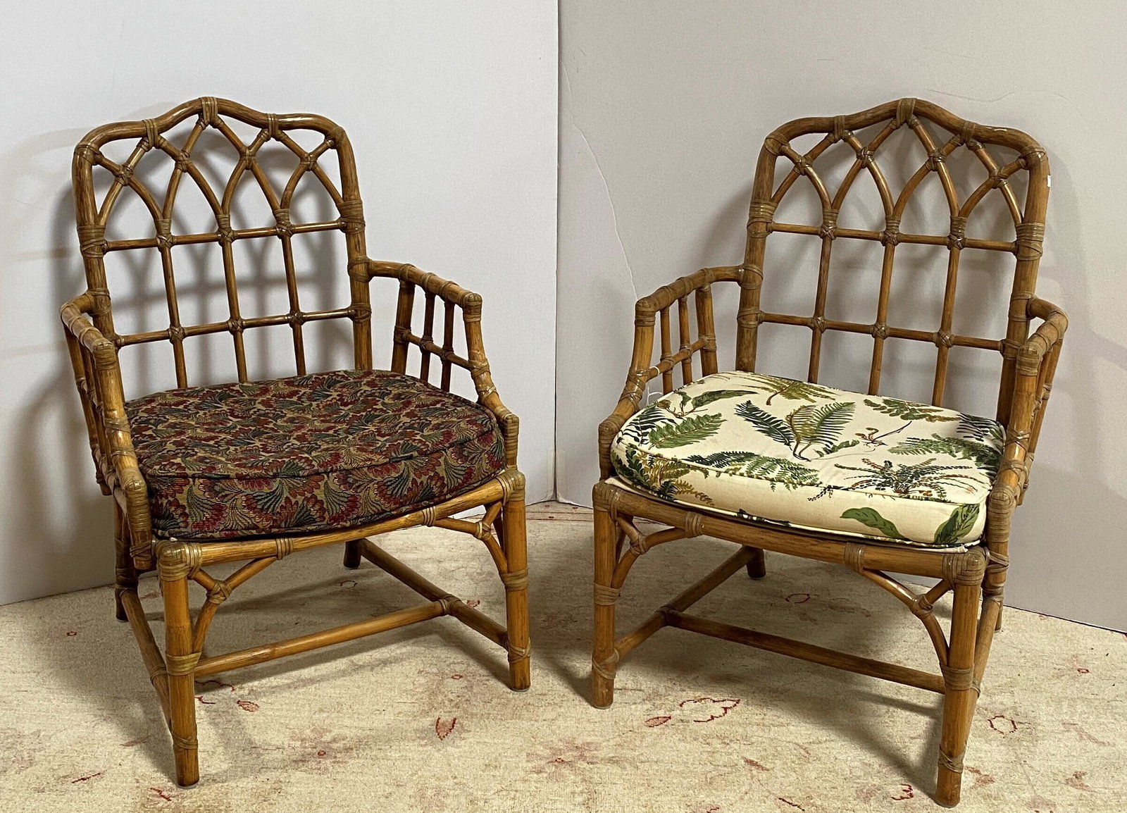 Pair of McGuire Armchairs: Of typical form, each with Gothic lancet style backs. 34in. (86cm) h. 23in. (58cm) w. 18in. (46cm) l. Â