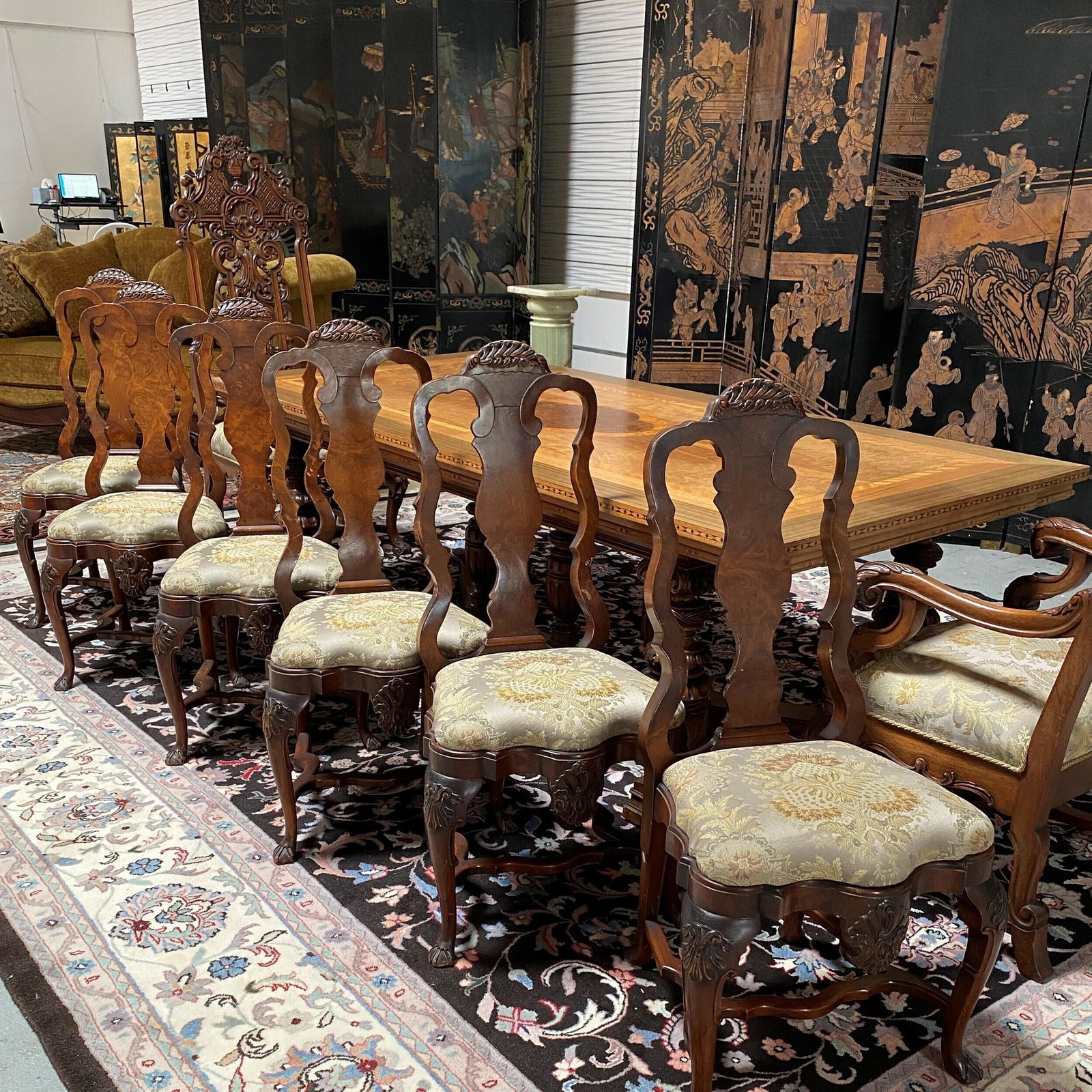 Six Dutch Baroque Style Chairs: Early 20th Century. Each with fan carved crest over vasiform splat and stiles above an undulating form seat upholstered with Fortuny style fabric raised on cabriole legs ending in drake feet. 42in. (1