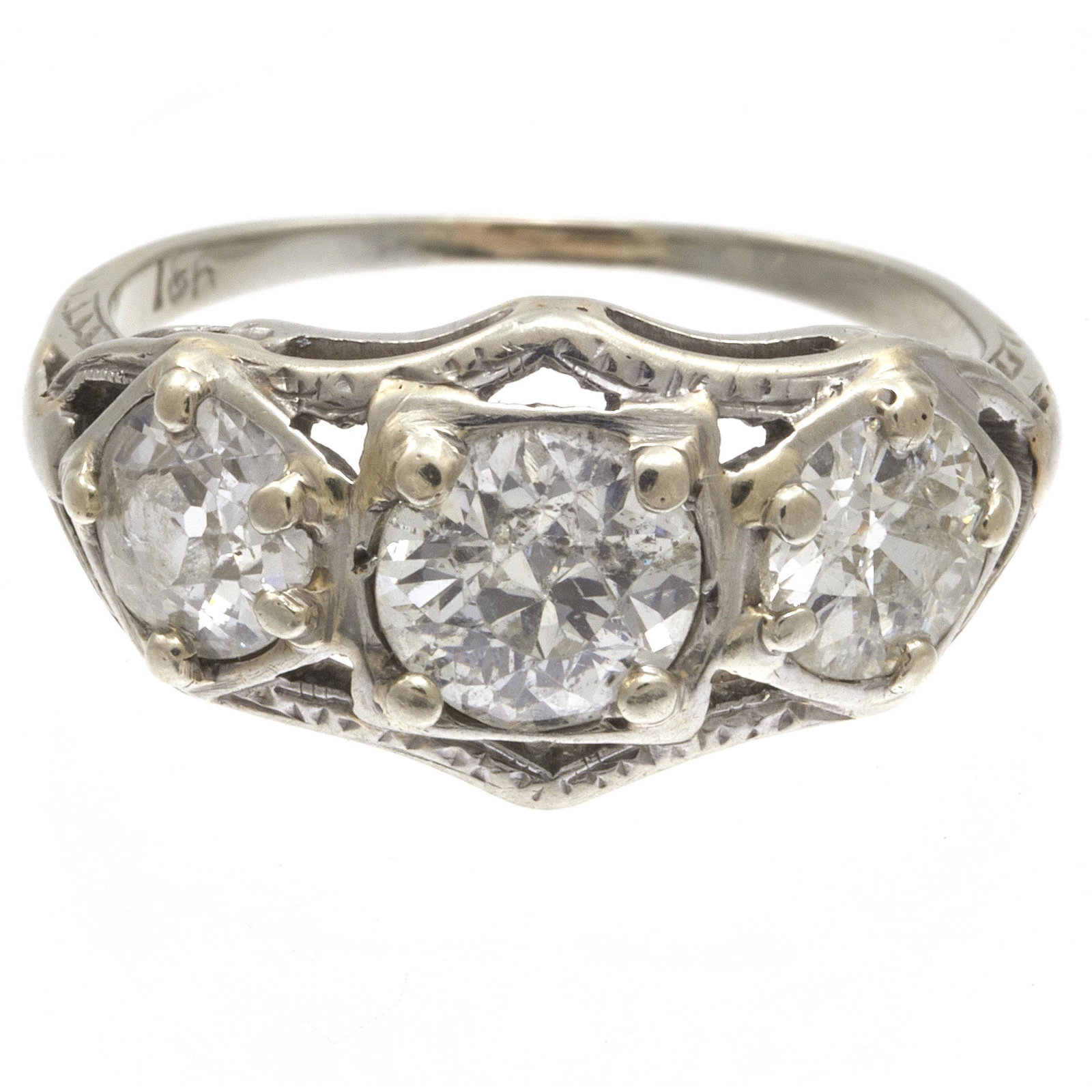 Edwardian Diamond, 18k White Gold Ring: Featuring three Old European-cut diamonds weighing a total of approximately 1.35 cttw., set in an 18k white gold ring mounting, size 3 3/4. Gross weight: 2.0 grams.