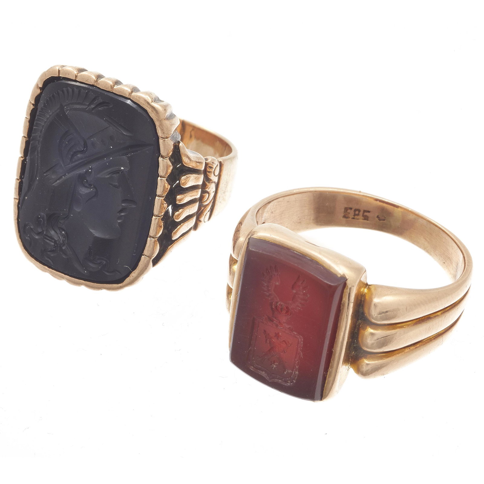 Collection of Two Victorian Intaglio Rose Gold Rings: Including one rectangle-shape carnelian intaglio seal depicting a winged crest, measuring approximately 13.0 x 9.0 mm, set in a 14k rose gold ring mounting, size 8; together with one rectangle-shape o