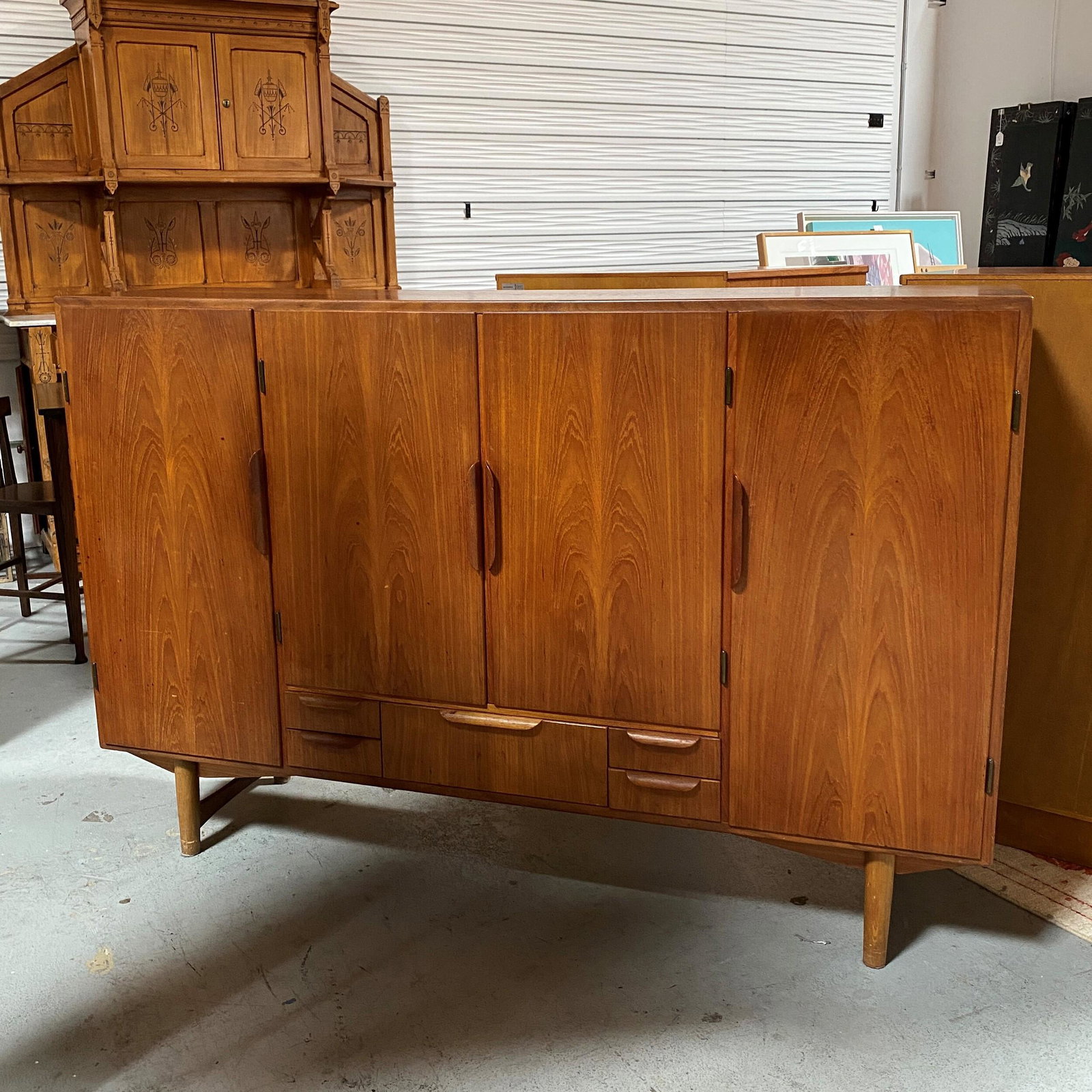 Danish High Credenza/Sideboard: Condition: Fair, areas of marks, scuffing. Doors and drawers work well, shelves have been replaced on left side section. 65in. L x 43in. H X 16 1/4in. W.