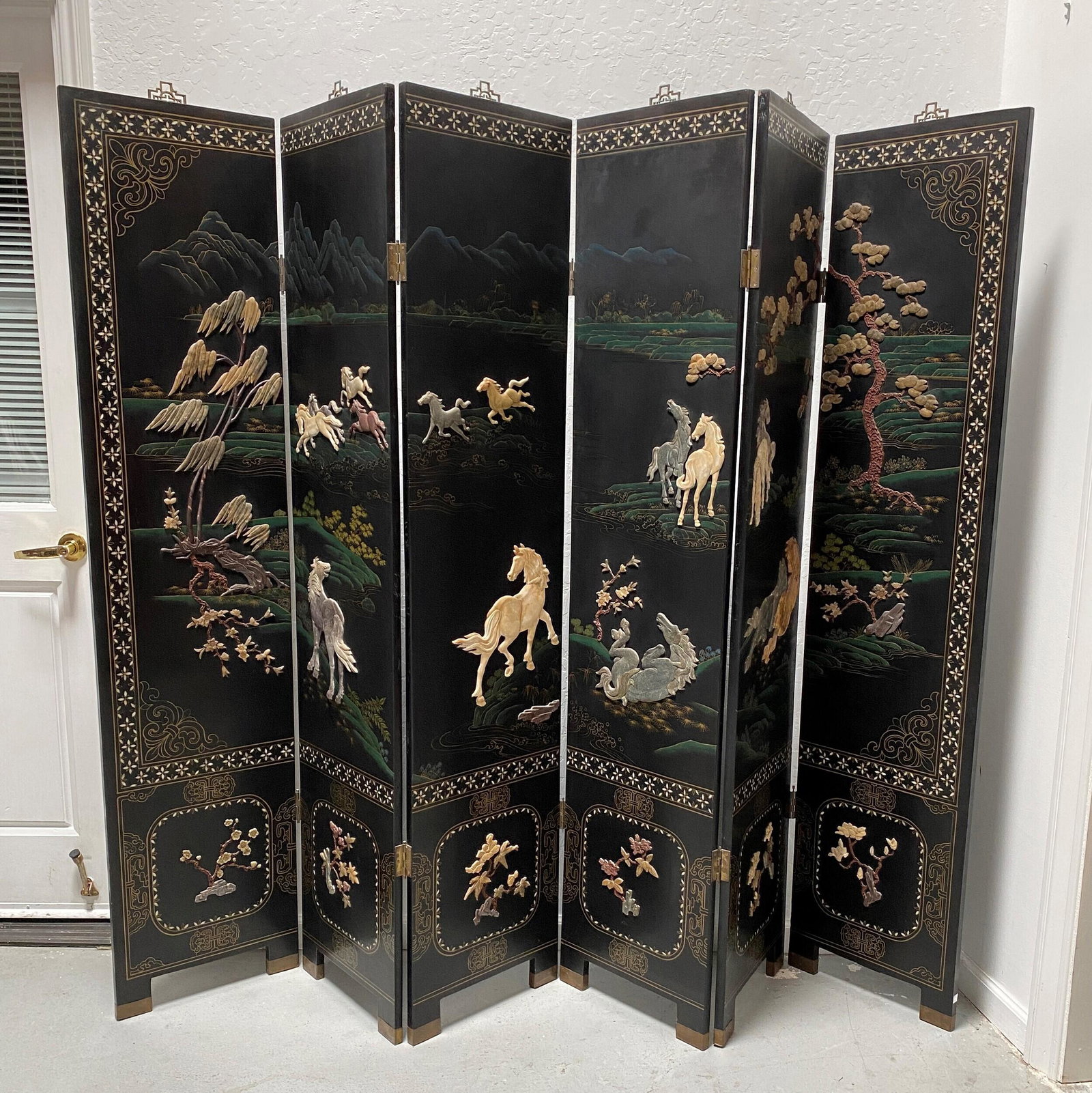 Six-Panel Lacquered Folding Screen, 20th Century: Decorated with soapstone to depict horses at leisure at the riverbank. 64 x 72 inches