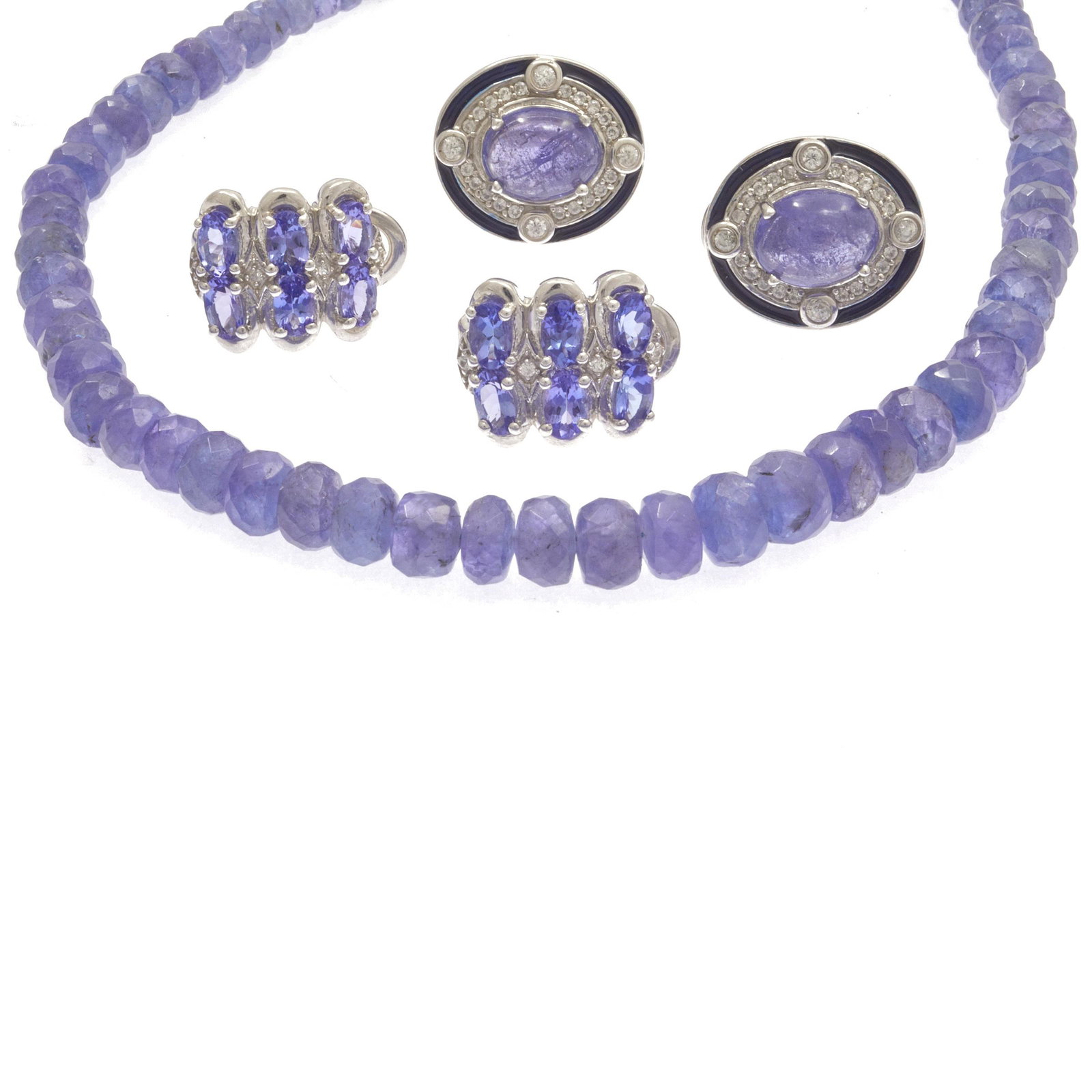 Collection of Tanzanite, Sterling Silver Jewelry Items: Including one pair of earrings, each featuring one oval-cut tanzanite cabochon measuring approximately 9.0 x 7.0 mm, accented by twenty-four round-cut white zircons, set in a sterling silver mounting;