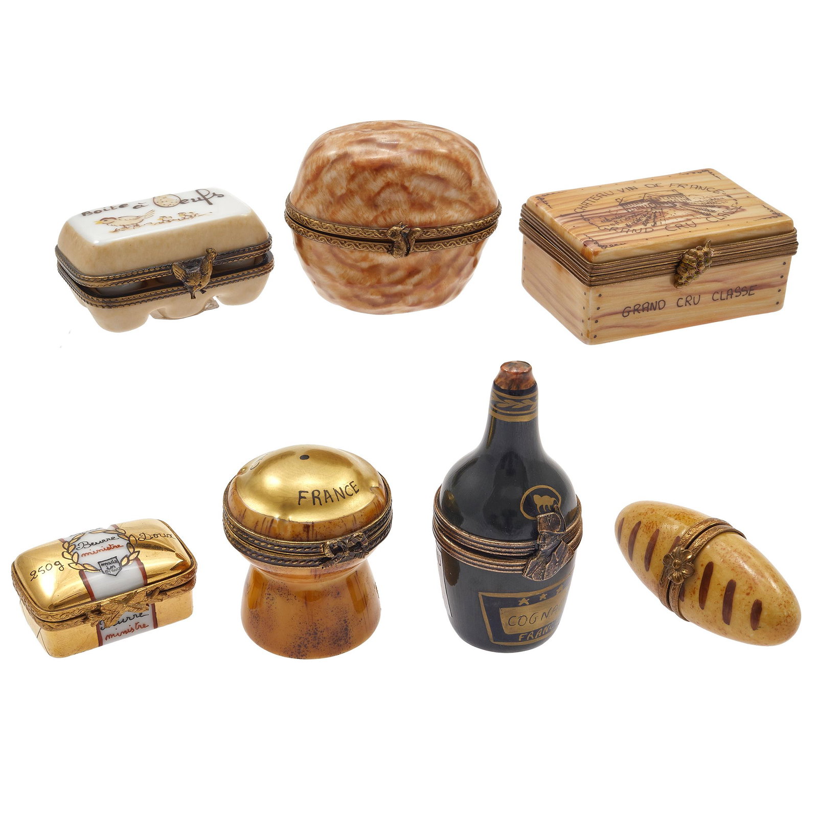 Collection of Limoges Boxes: Including a Champagne cork, Boîte a Oeufs, Vin de France, a Baguette and Bottle of Brandy. Seven boxes. Greatest height 2in. (5cm)