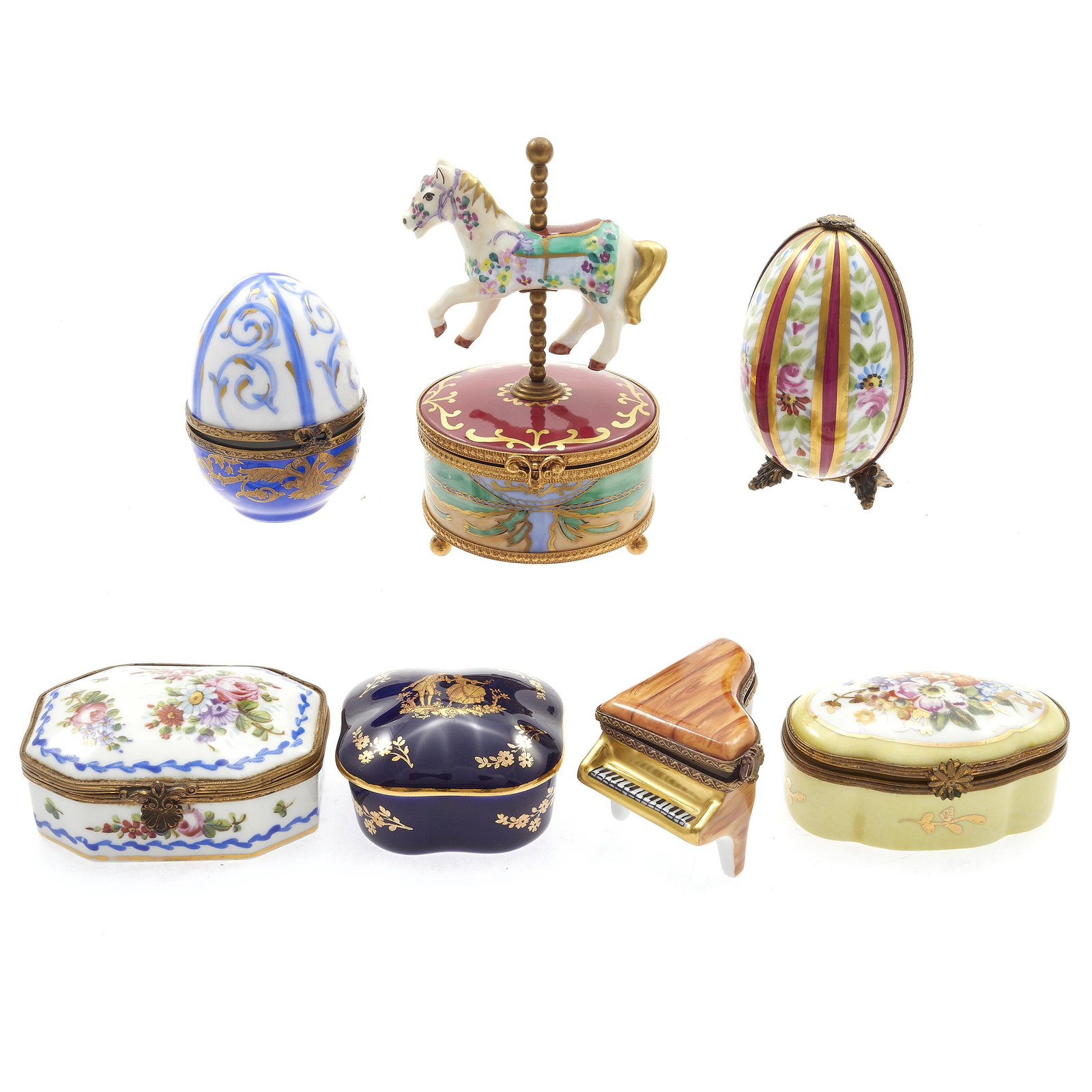 Collection of Limoges Boxes: Including a Carousel horse music box, Faberge style egg, Piano and floral decorated boxes.Seven boxes. Greatest height 4in. (10cm)