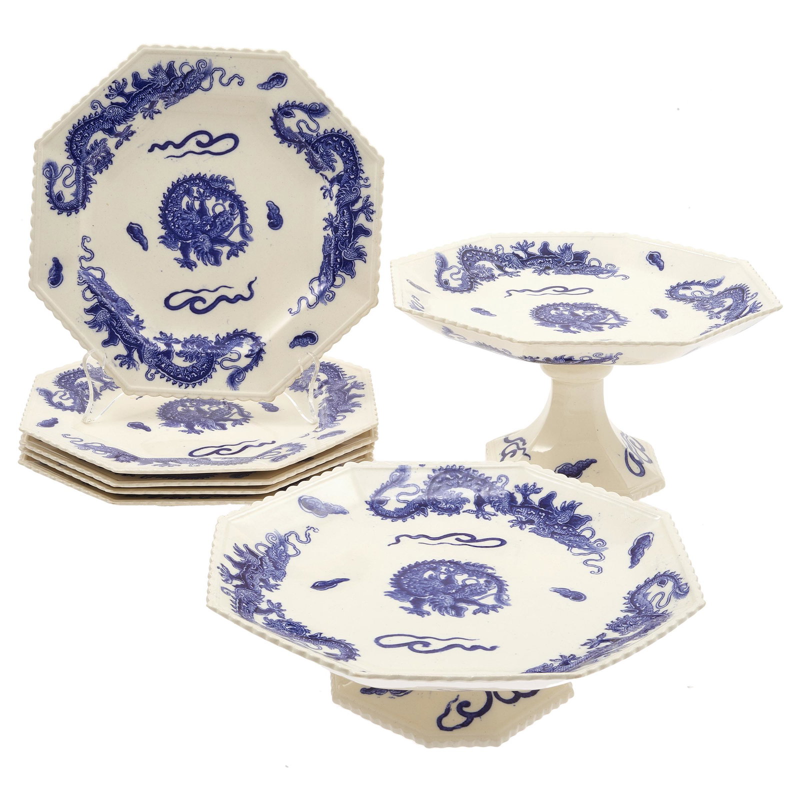 Copeland Japanesque Porcelain Mid 19th Century: An afternoon tea service comprising; two pedestal servers and six plates each transfer decorated with four claw wrythen dragons amid stylized clouds. Impressed mark for 1850. height of first server 5i