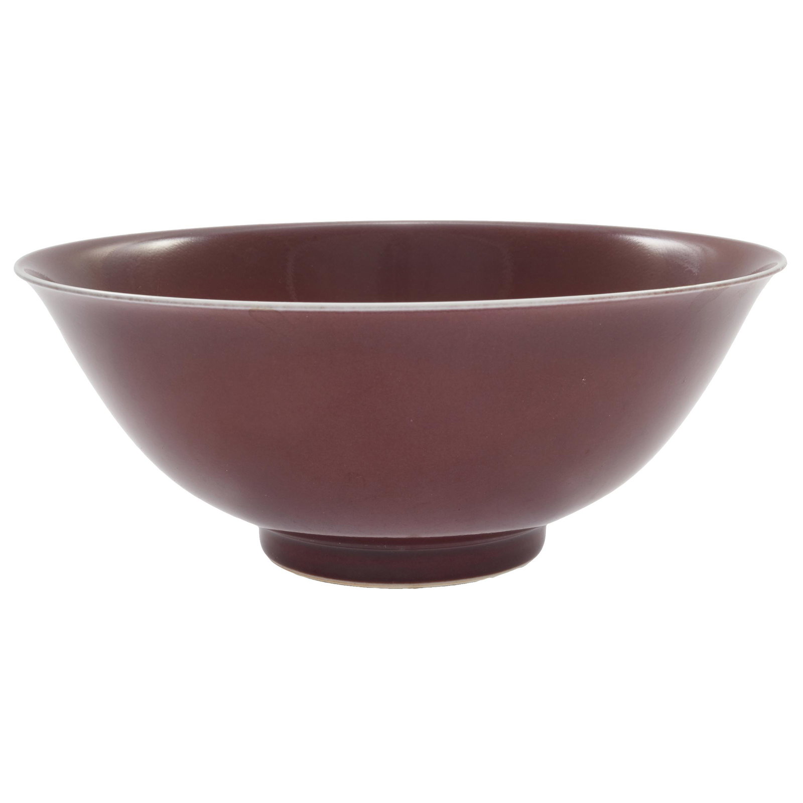 Copper Red Glazed Bowl, Qianlong Mark: The everted bowl covered in a 'sang de boeuf' colored glaze, the recessed base with an underglaze blue reign mark within a double circle. Diameter: 6 1/4 inches