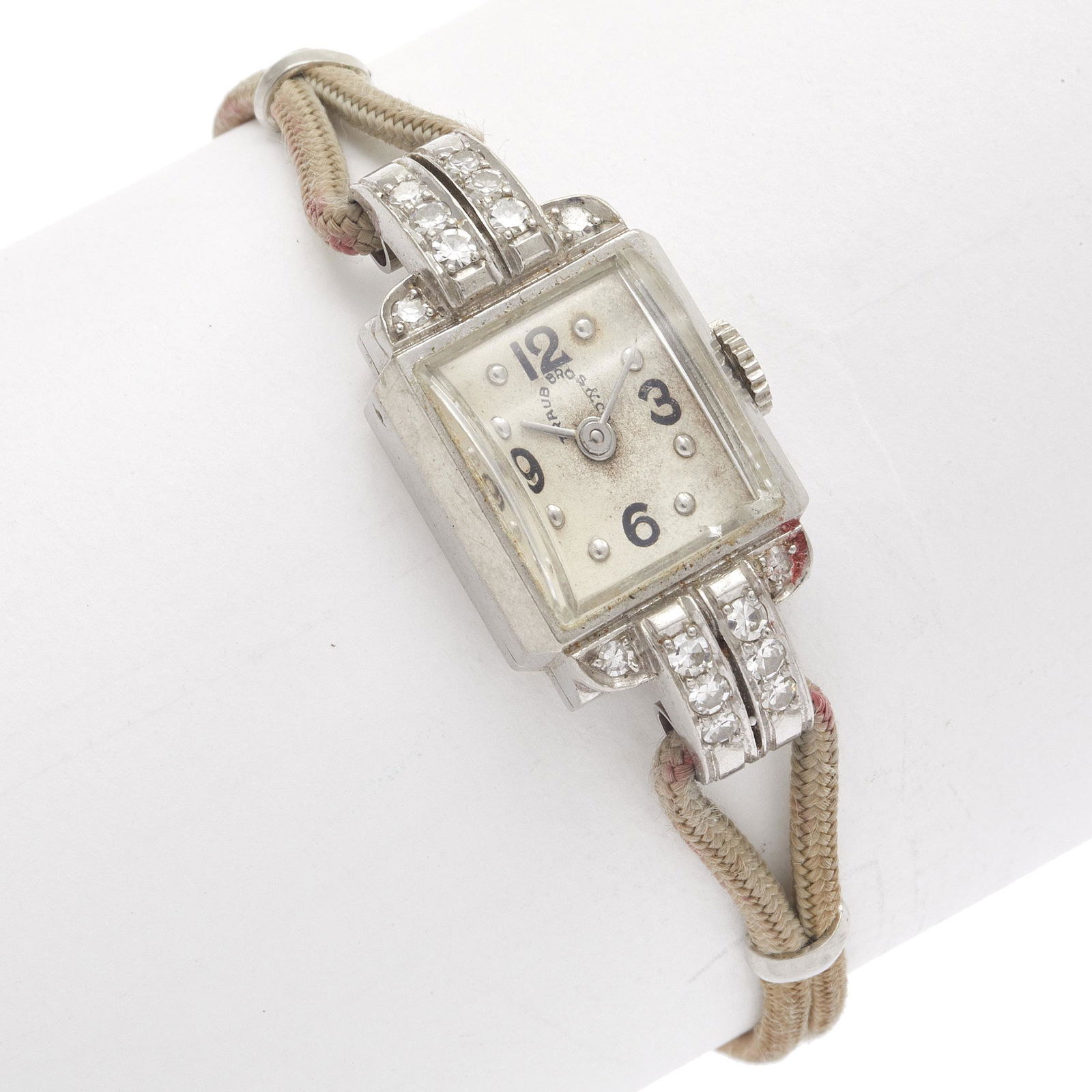 Ladies Diamond, Platinum Wristwatch: DIAL: Rectangle, silvered, black Arabic and applied silver dot hour markers, silver baton hands. MOVEMENT: Manual wind and set, seventeen (17) jewels, Cresarrow Watch Co. Swiss movement, CX0. CASE: Re