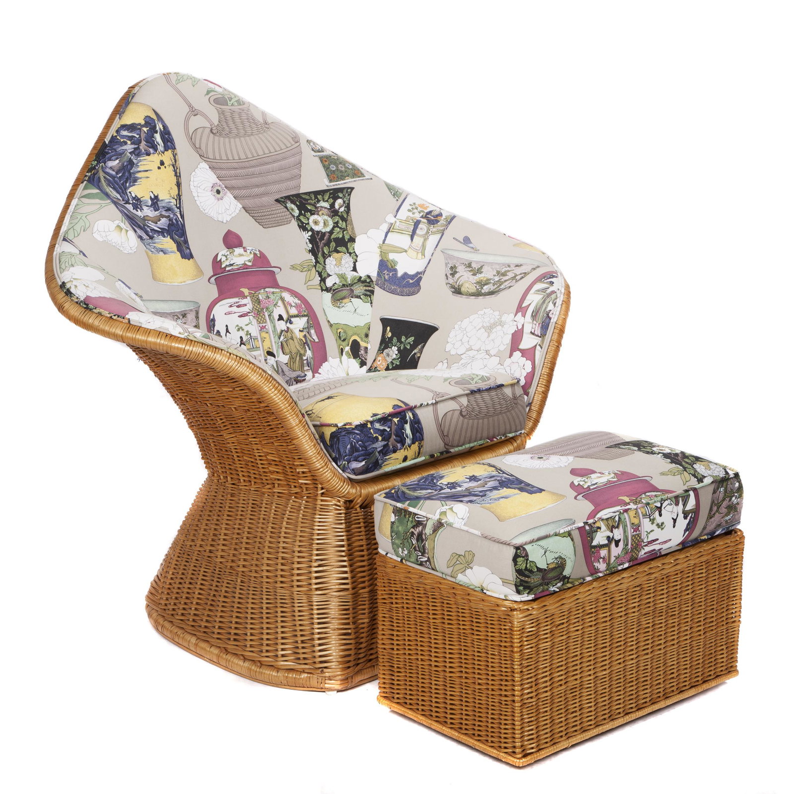 McGuire Gothic Lounge Chair and Ottoman: The upholstered chair with Gothic arch continuing to outset arms, together with an ottoman on casters. Chair: 42in. (107cm) h. 42in. (107cm) w. 20in. d Ottoman: 11in. (28cm) h. 14in. (36cm) w. 23i