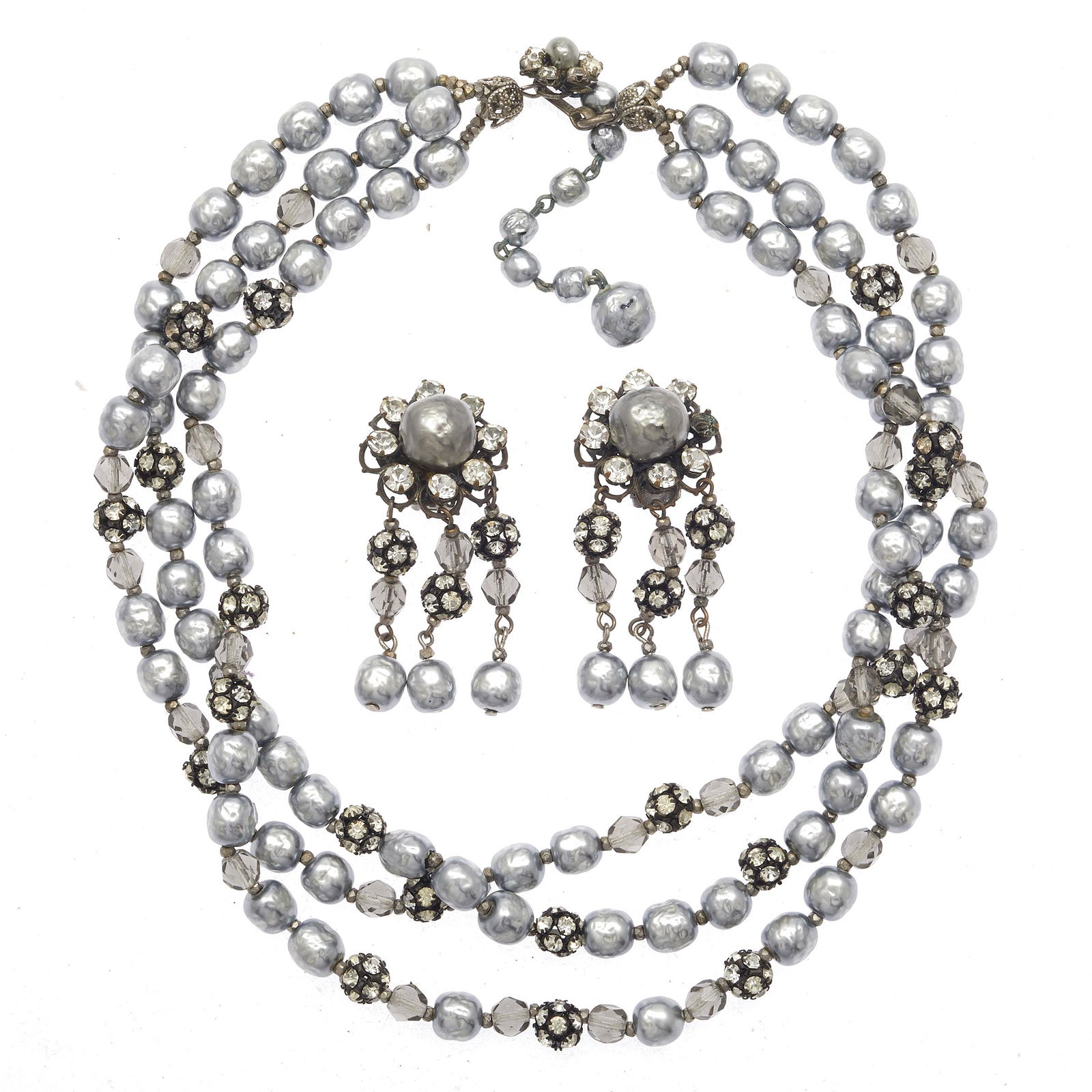 Miriam Haskell Faux Pearl Jewelry Suite: Including one triple-strand faux baroque pearl necklace accented by rhinestone and faceted glass beads, 16 inches with chain extender, together with a pair of matching ear clips. All signed. #costumej
