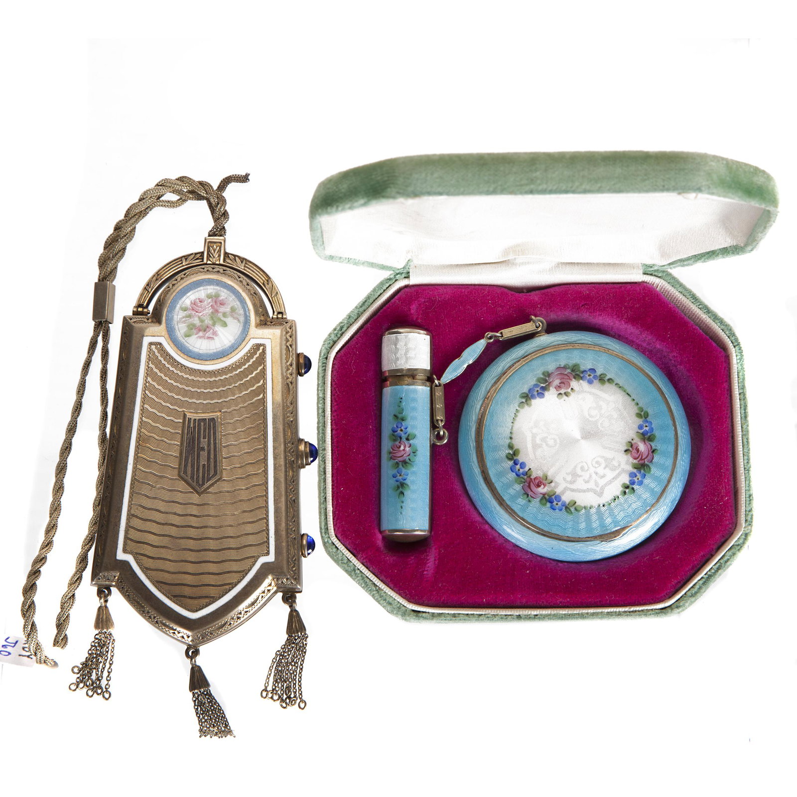 Art Deco Sterling Minaudiere: The silver gilt case hanging from a wristlet with inset cloisonne rondel opening to a mirrored case with two hinged compartments. 4in. (10cm) l . 98 grams. Together with an enamel compact and lipstick