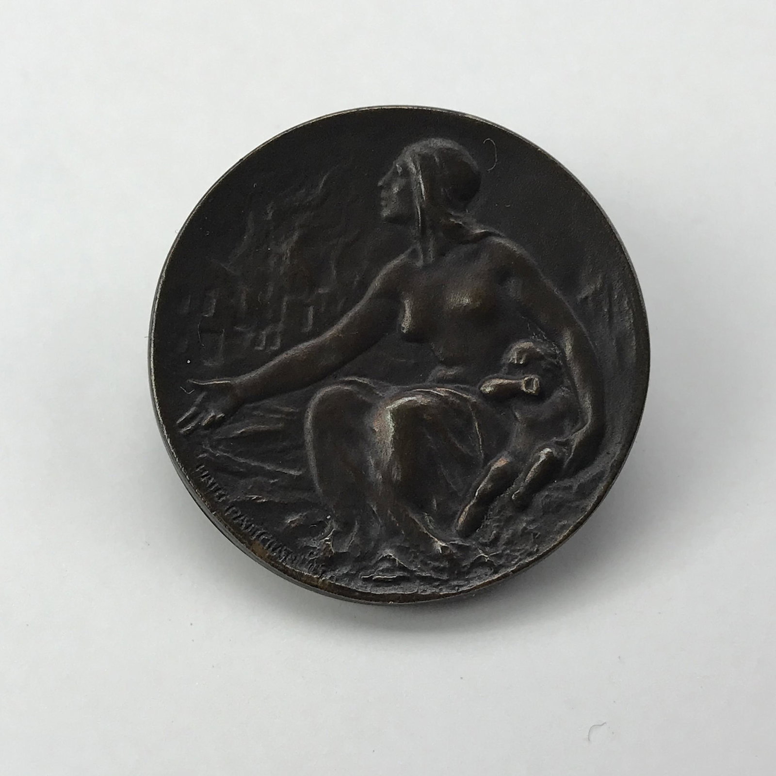 1917 Shreve Haig Patigian Bronze Armenian Relief Pin: This is a 1917 Shreve Co. Haig Patigian Armenian Relief pin. Measures 1 inch in diameter. This pin depicts a grieving mother with an infant, looking upon her home and c