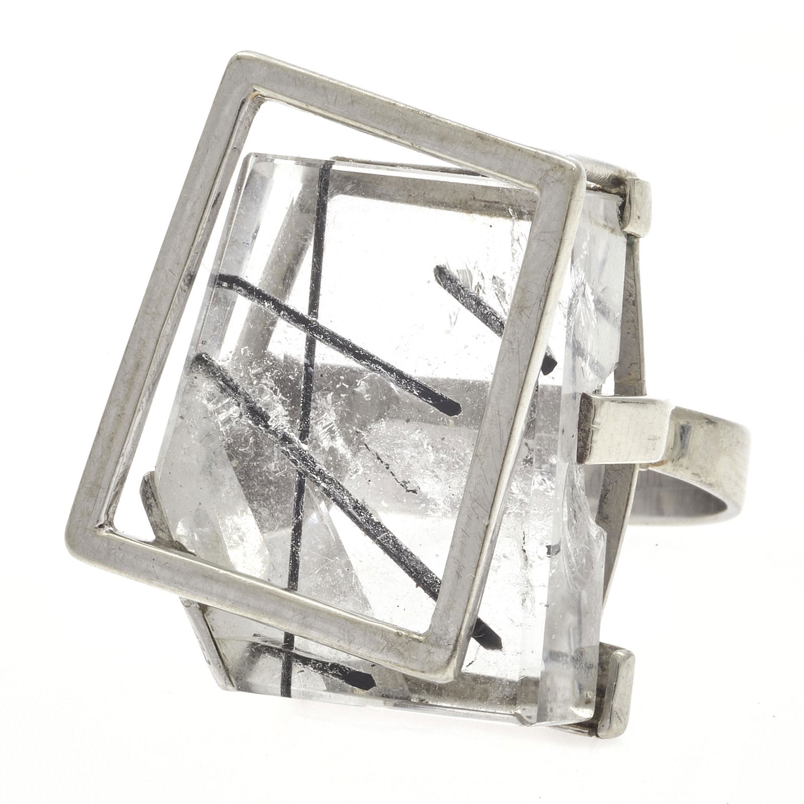 Margaret De Patta Tourmalated Quartz, 14k Ring: Margaret De Patta Modernist Tourmilated Quartz, 14k Ring Centering a tourmalated quartz set in an abstract, asymmetric 14k white gold ring mounting measuring approximately 23.7 x 19.8 mm (0.93 x 0.78
