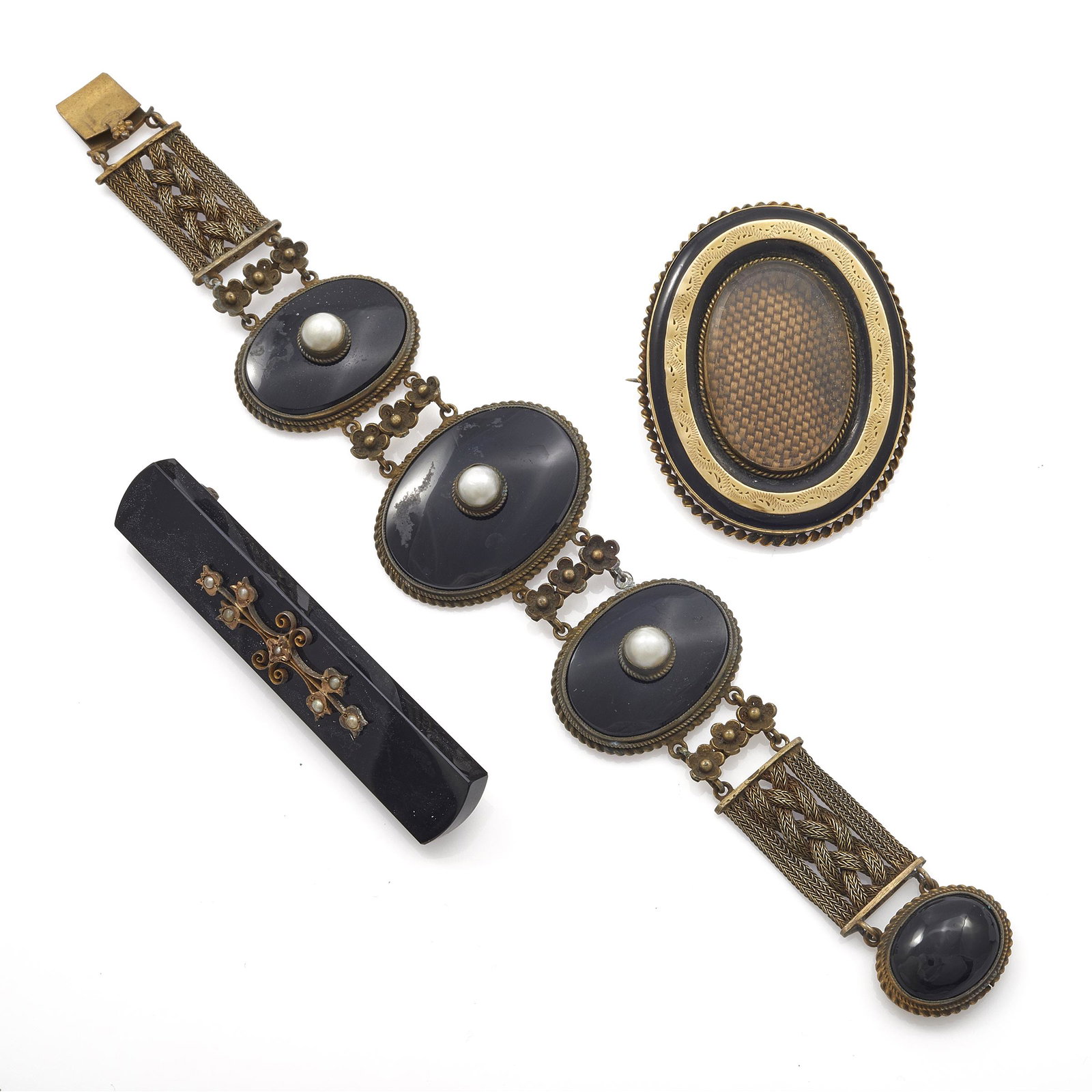 Collection of Victorian Mourning Jewelry: Collection of Victorian Mourning Jewelry Including one oval pin centering woven hair set in a rose and yellow gold-filled mounting measuring approximately 49.8 x 39.2 mm (1.96 x 1.54 in); one bar pin 