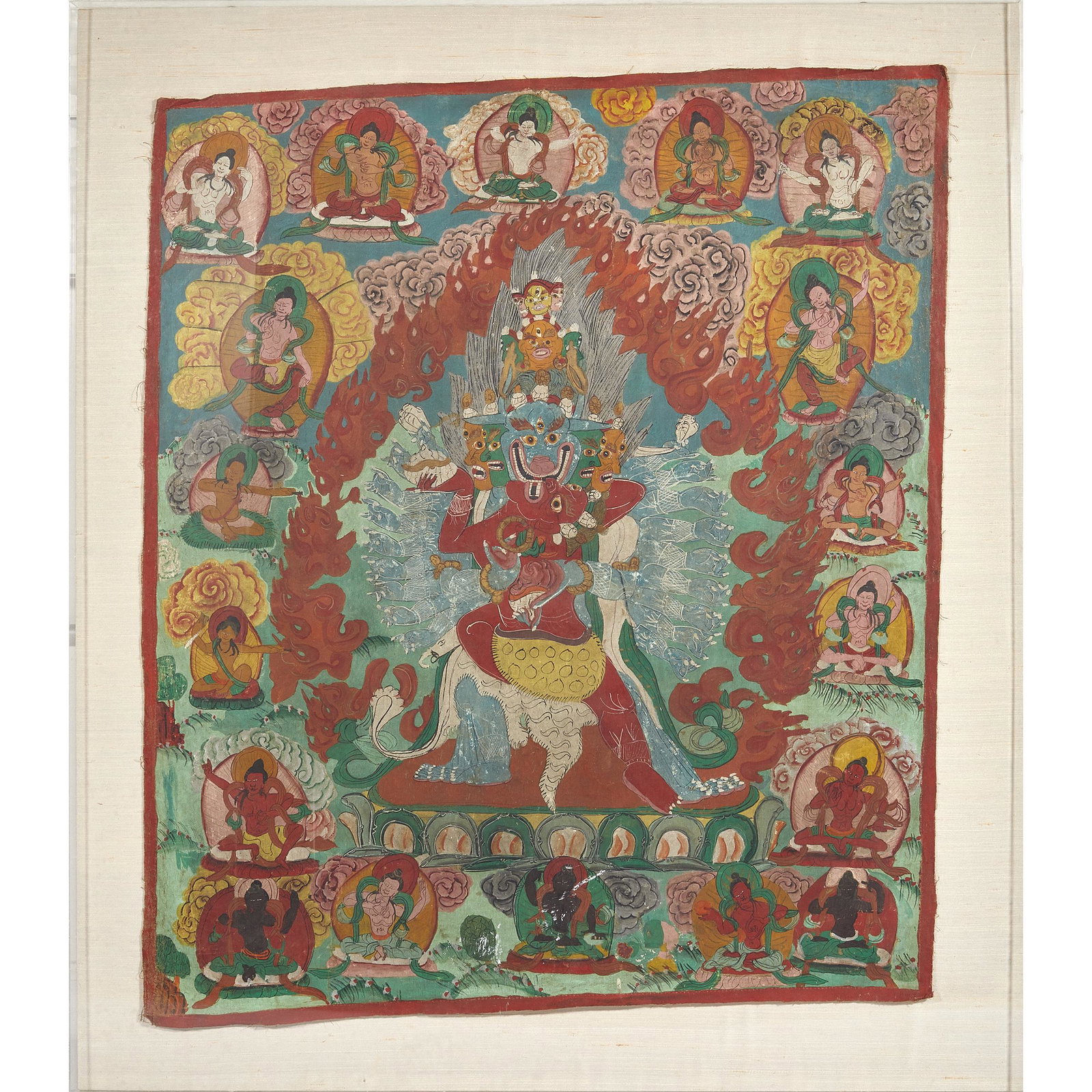 Thangka Fragment: The Thangka fragment presented in a plexiglass box frame. Fragment: 28in. x 32in. (71cm. x 81cm) Framed: 36in. x 41in. (91cm. x 104cm)