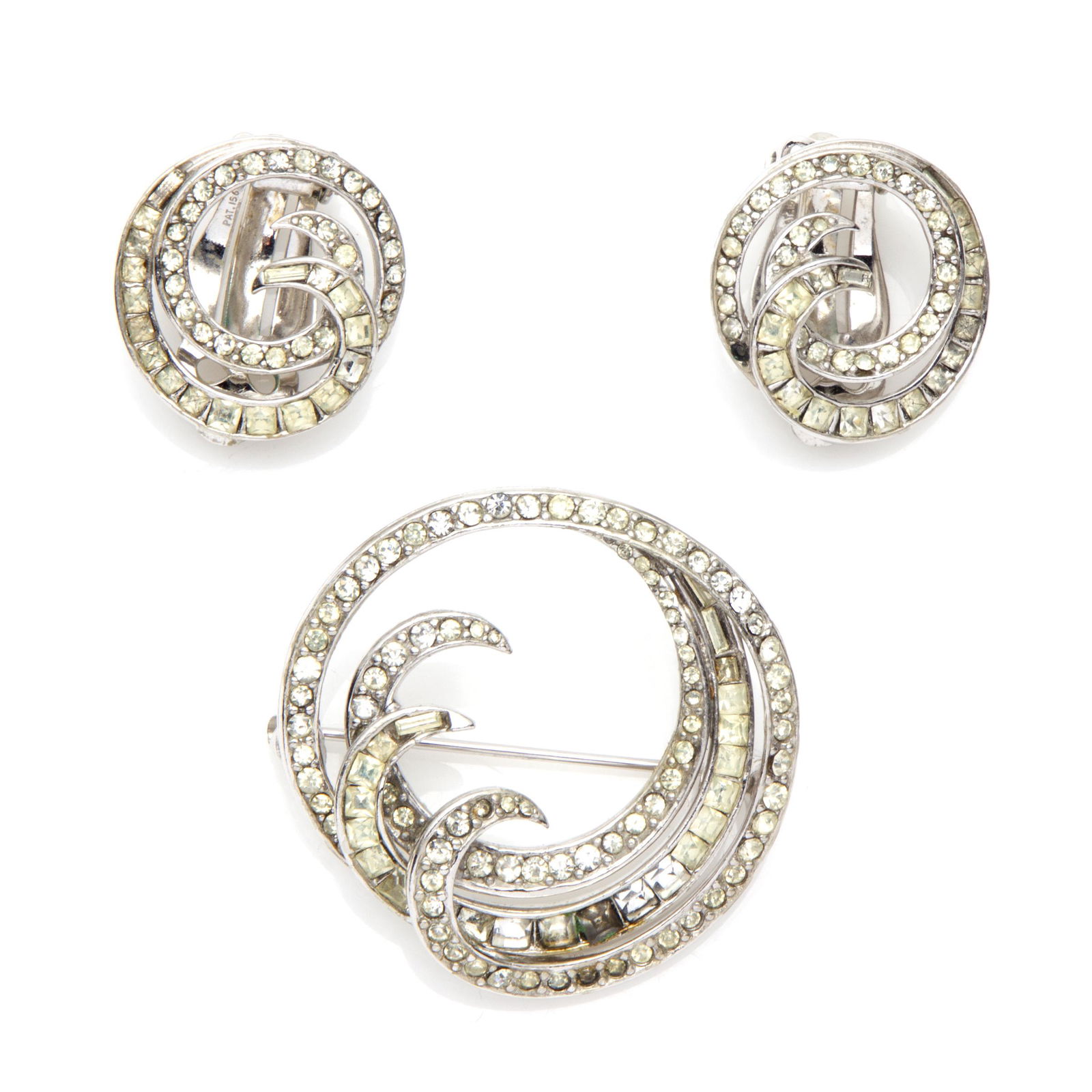 Rhinestone Pin and Pair of Ear Clips, Ciner: Featuring numerous colorless rhinestones set in a swirl motif white metal pin mounting measuring approximately 33. 6 mm (1.32 in); together with a pair of matching ear clips, each measuring approximat