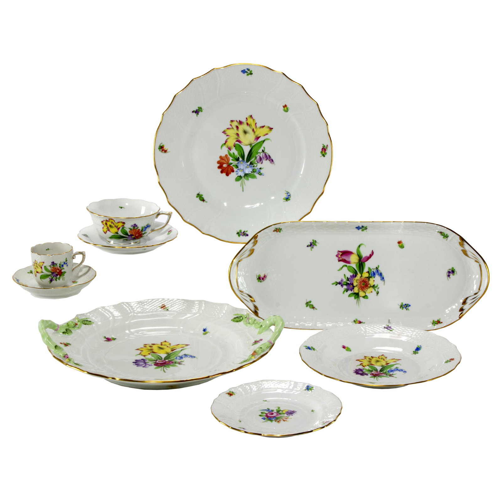 Herend Porcelain Part Dinner Service: In the Printemps pattern with gilt band and blue factory mark, comprising; Twelve ten inch dinner plates, twelve 8 1/4in. plates, twelve 6in. plates, twelve 4 1/4in. diameter coffee cups, twelve 6in. 