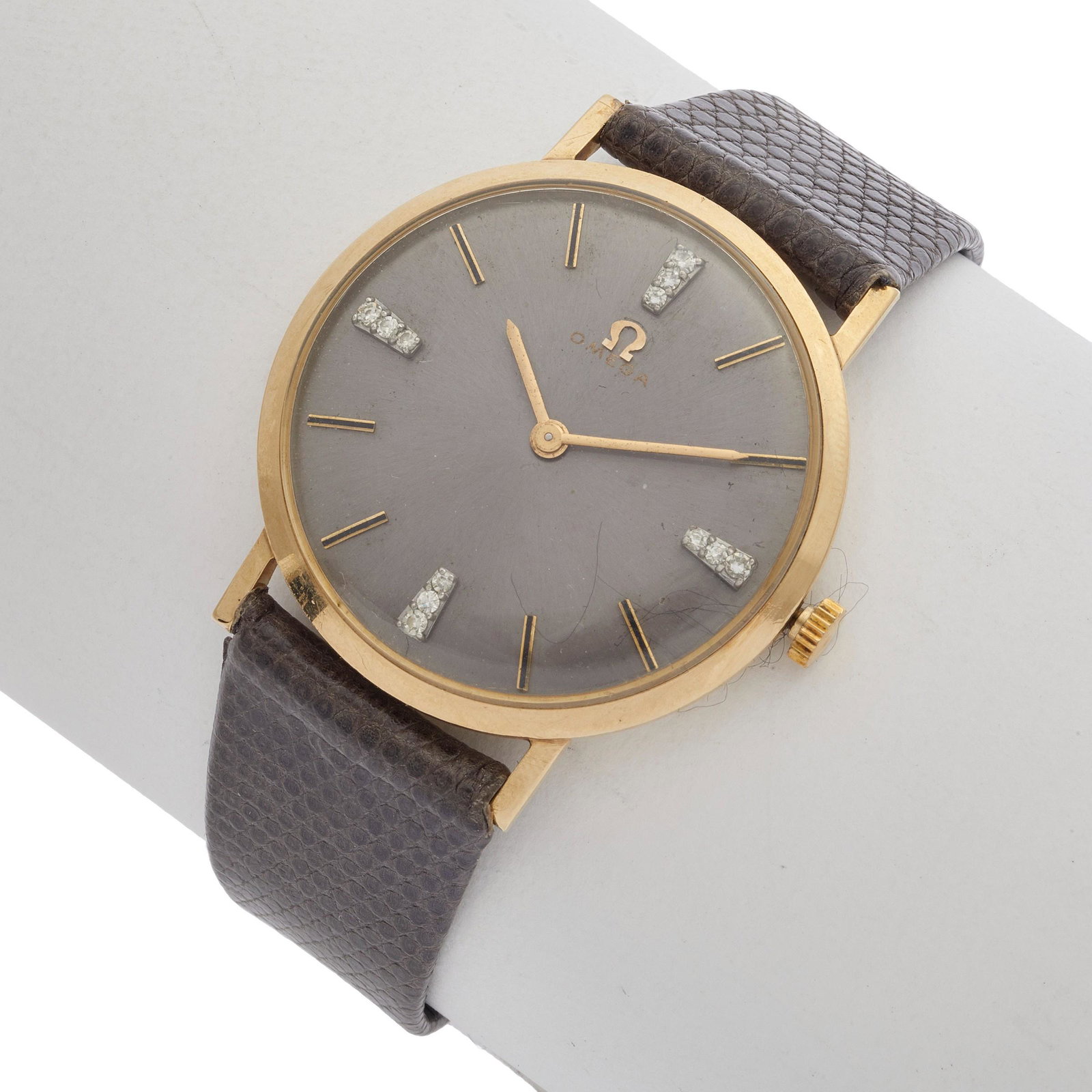 Omega Gent's 14k Yellow Gold Wristwatch: Omega Gent's 14k Yellow Gold Wristwatch DIAL: Round, gunmetal, applied gold index and diamond hour markers, gold baton hands, Omega. MOVEMENT: Mechanical, seventeen (17) jewels, unadjusted, Omega Watc