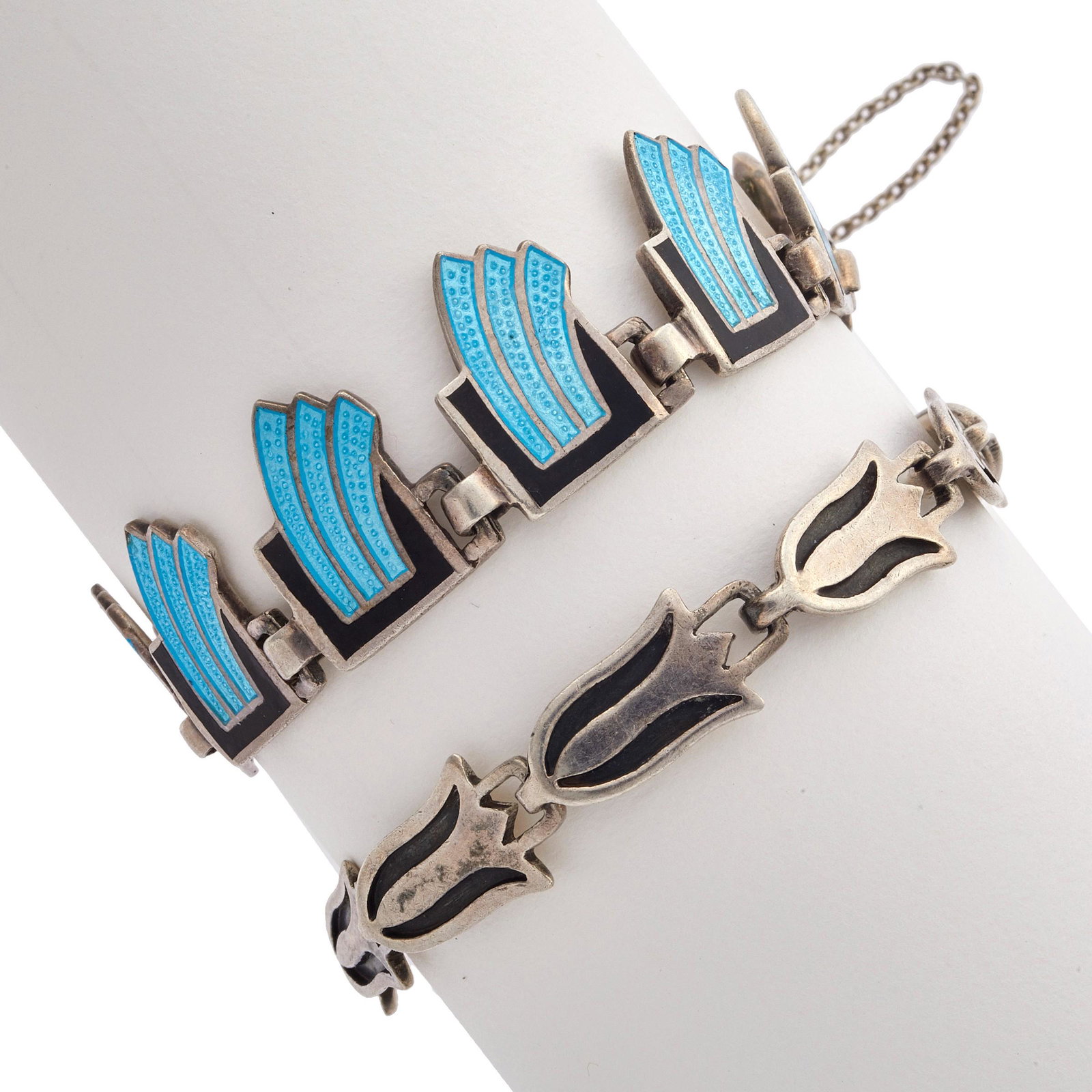 Two Mexican Modernist Enamel, Sterling Bracelets: Two Mexican Modernist Enamel, Sterling Bracelets Including links designed as waves, each highlighted by blue and black champleve enamel, completed by a box clasp with safety chain forming a 6 1/4 inch
