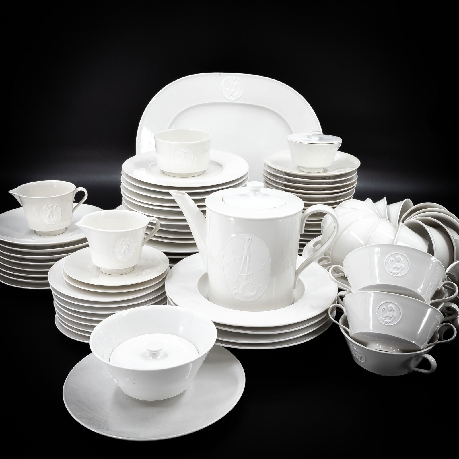 KPM Koniglich Porzellan Manufactor Arcadia Pattern: KPM Koniglich Porzellan Manufactor Arcadia Pattern A large set of 87 pieces of dinner ware, including; all with underglaze cobalt mark for KPM Ten 10in. dinner plates with bisque medallion of a nymph,