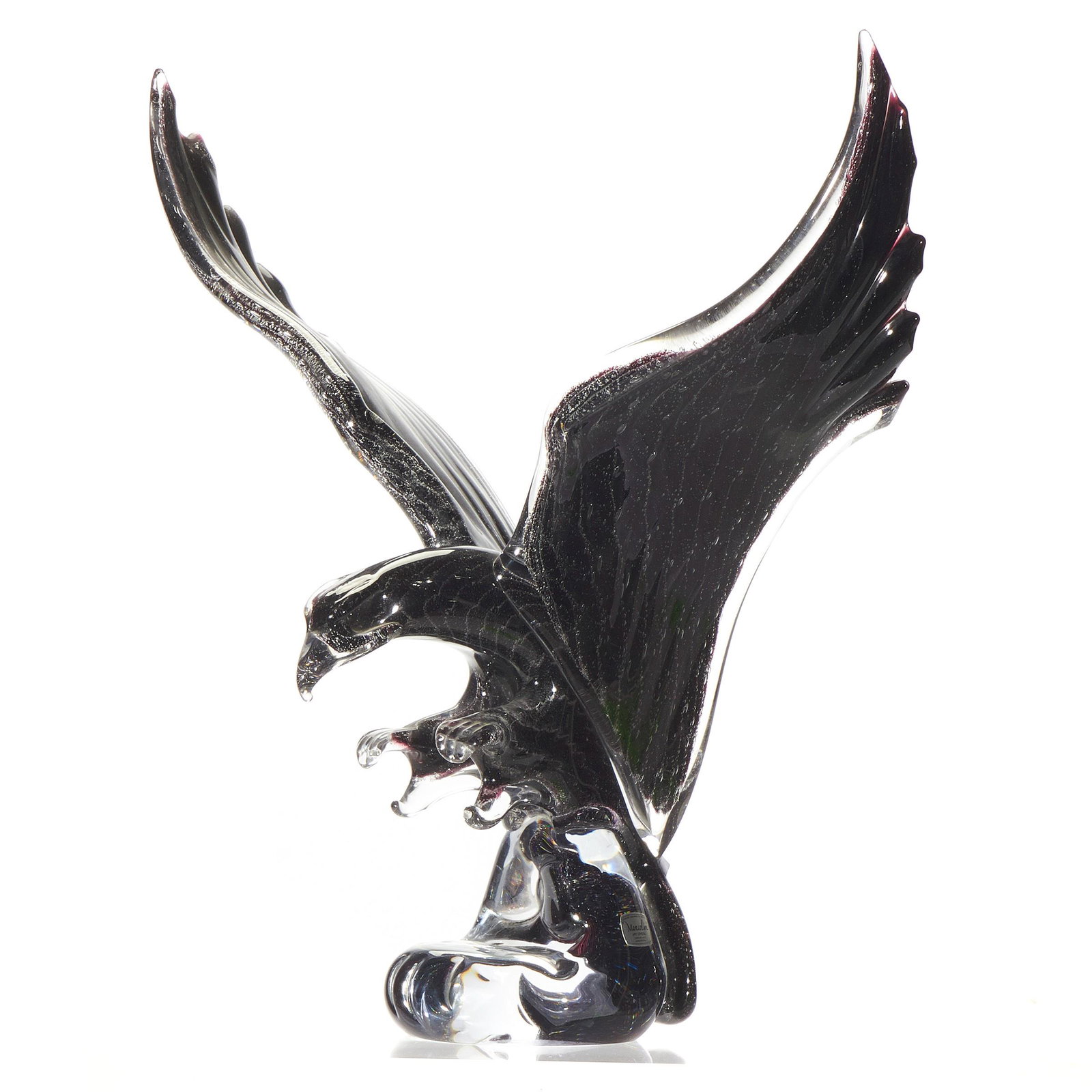 Marcolin Glass Sculpture of an Eagle: Marcolin Glass Sculpture of an Eagle The smoky glass sculpture depicting a wingspread eagle. 16 1/2in. (42cm) h 16 1/2in. (42cm) l. Bearing label and Signed on base