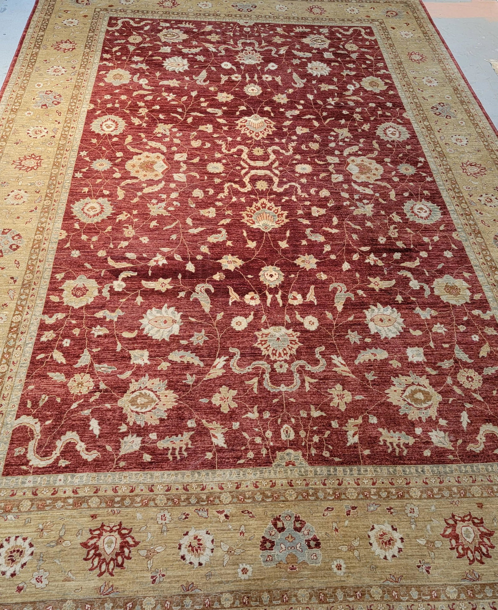 Mughal Style Carpet: The lotus banding centering a terra-cotta field.17ft. x 14ft. (approx.)