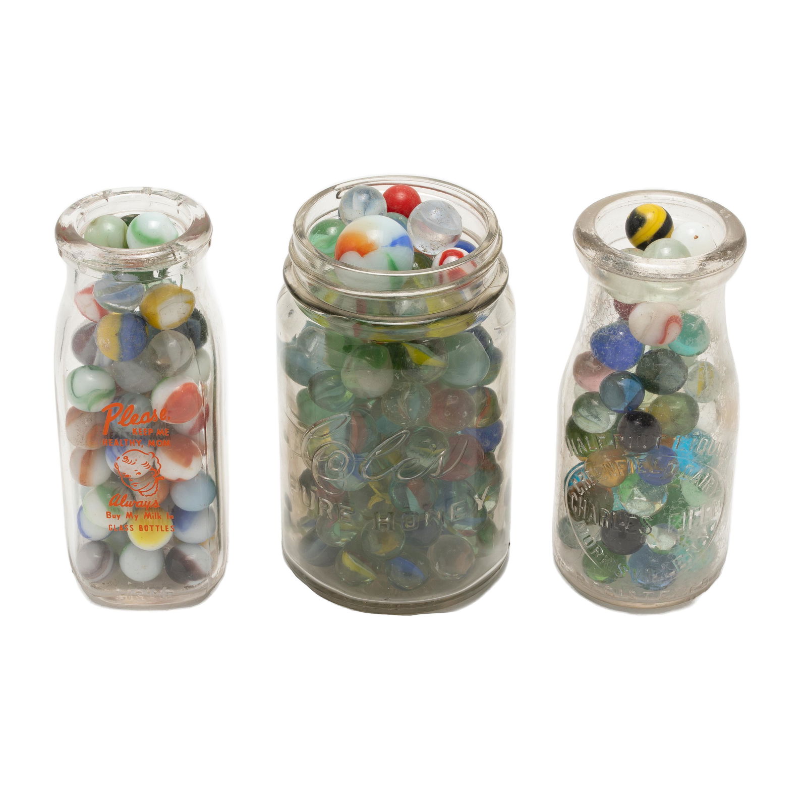 Vintage Marbles: Lot of approximately 200+ early marbles. Clear and swirl glass examples. Most measure approximately 6/8th inch. Some smaller and some larger. Largest measures approximately 1". Some chipped or broken.