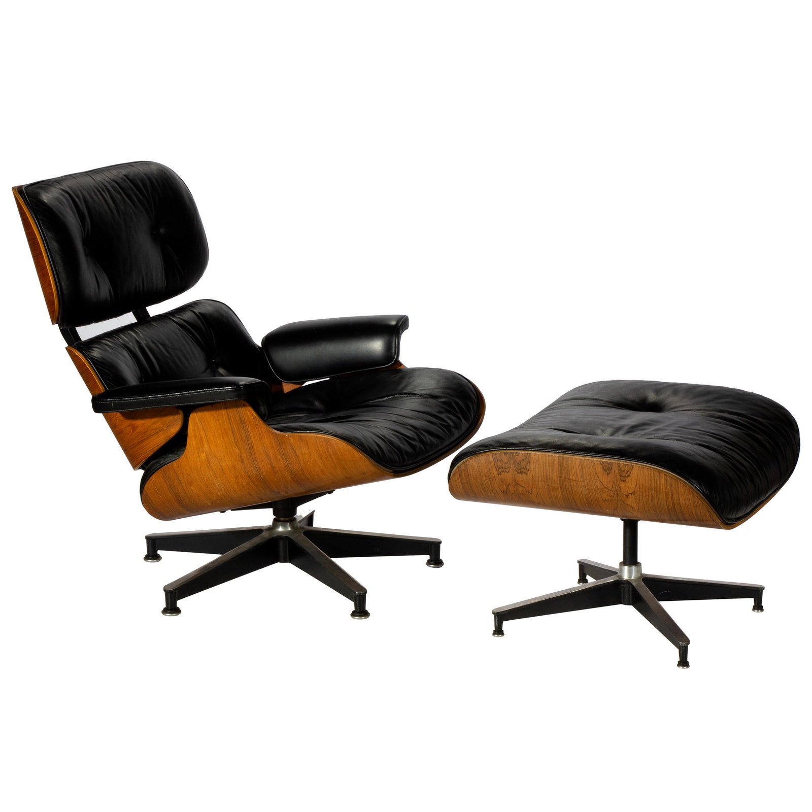 Herman Miller Eames Chair and Ottoman: No. 670 & 671. Chair 32in.(81cm) h. 32in. (81cm) w. 19in. (48cm) d. Ottoman: 16in. (41cm) h. 26in. (66cm) w.