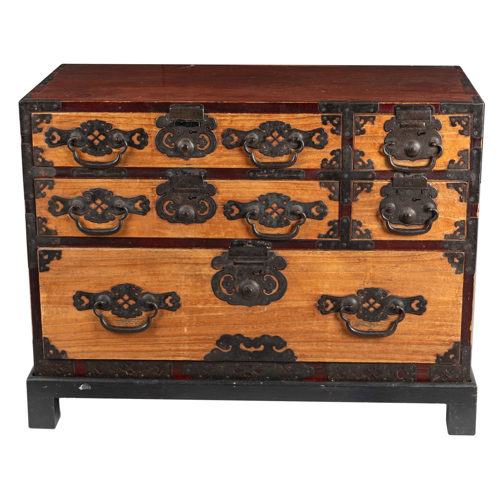 Japanese Meiji Tansu: Japanese Meiji Tansu Late 19th/early 20th Century The rectangular top over an arrangement of long and short drawers over a long drawer overall with decorative iron mounts and hardware, ending on a lat