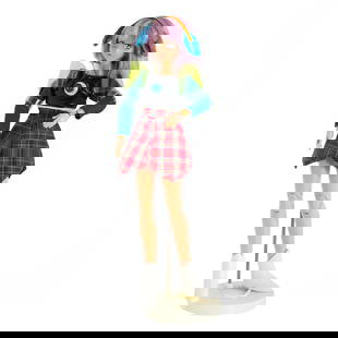 Mariko Mori (Japanese b. 1967) Star Doll, 1998. Parkett 54: Doll with headphones, plaid skirt and white boots.Edition 55 of 99.10in. h.Certificate of Authenticity Signed by Mariko MoreMariko Mori's work often explores themes of technology, spirituality and tra