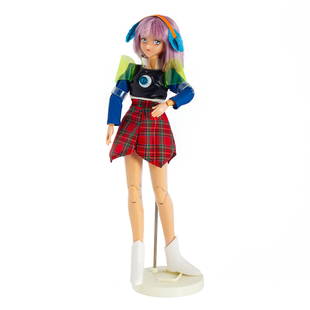 Mariko Mori (Japanese b. 1967) Star Doll, 1998. Parkett 54: Doll with headphones, plaid skirt and white boots. Edition 55 of 99. 10in. h. Certificate of Authenticity Signed by Mariko More Mariko Mori's work often explores themes of technology, spirituality