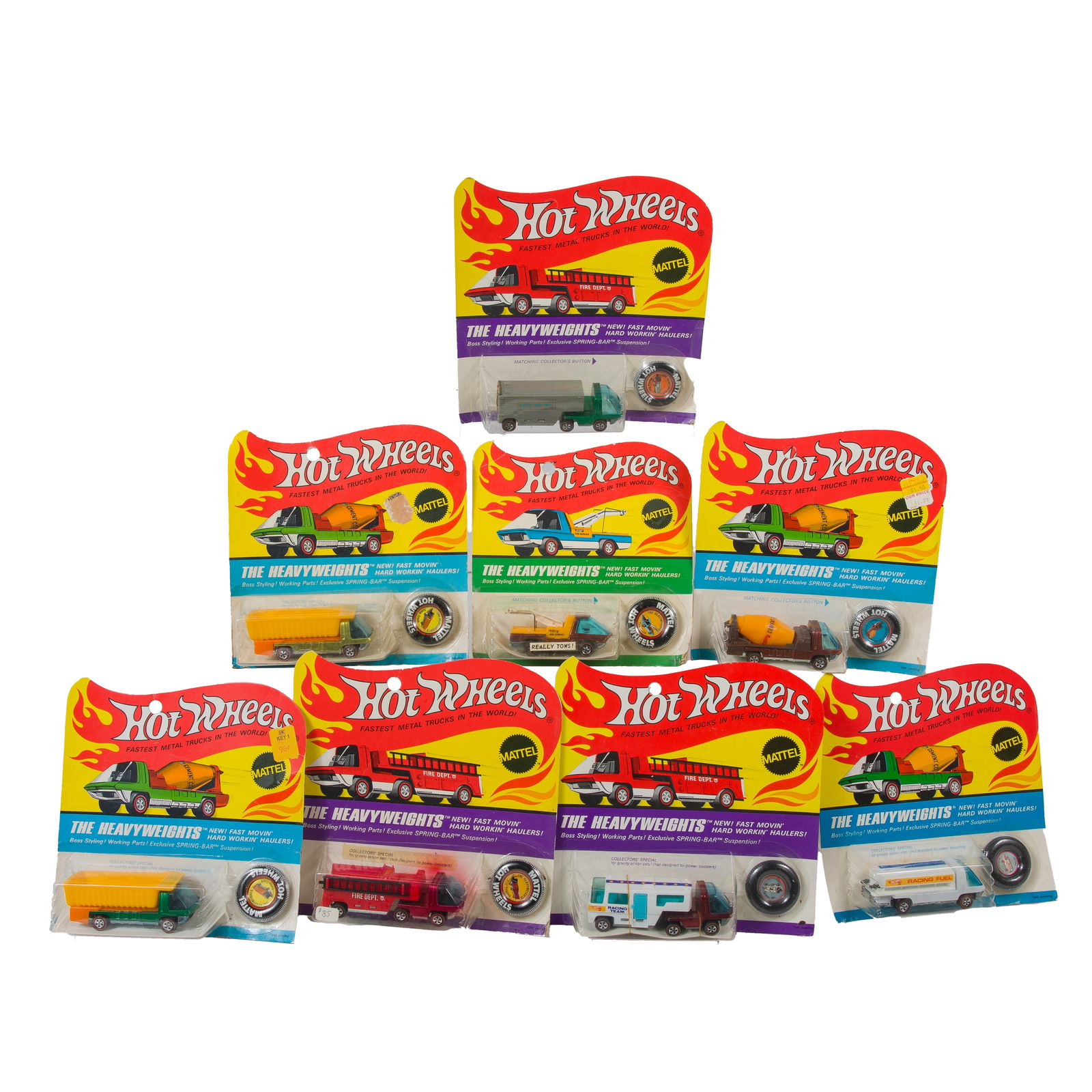 1969 Hot Wheels Heavyweights Redlines: Eight Hot Wheels Heavyweights Redlines, with button, new in blister packs. Including: Fire Engine, Team Trailer, Dump Truck x 2, Tow Truck, Fuel Tanker, Cement Mixer, and Moving Van. Back of each mark