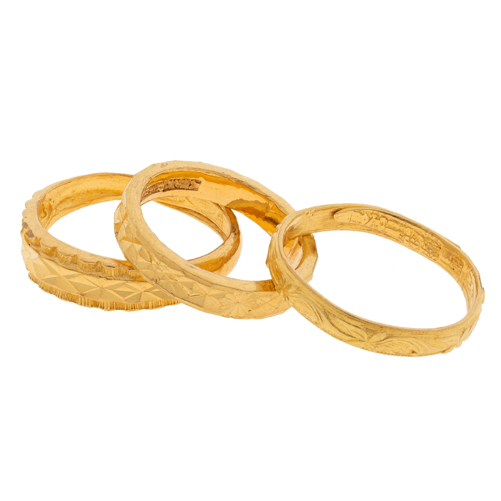 Collection of Three 24k, 22k Yellow Gold Rings: Collection of Three 24k, 22k Yellow Gold Rings All with foliate or bright-cut detailing, including two 22k yellow gold rings, one size 6, the second with an adjustable size; together with one 24k yell