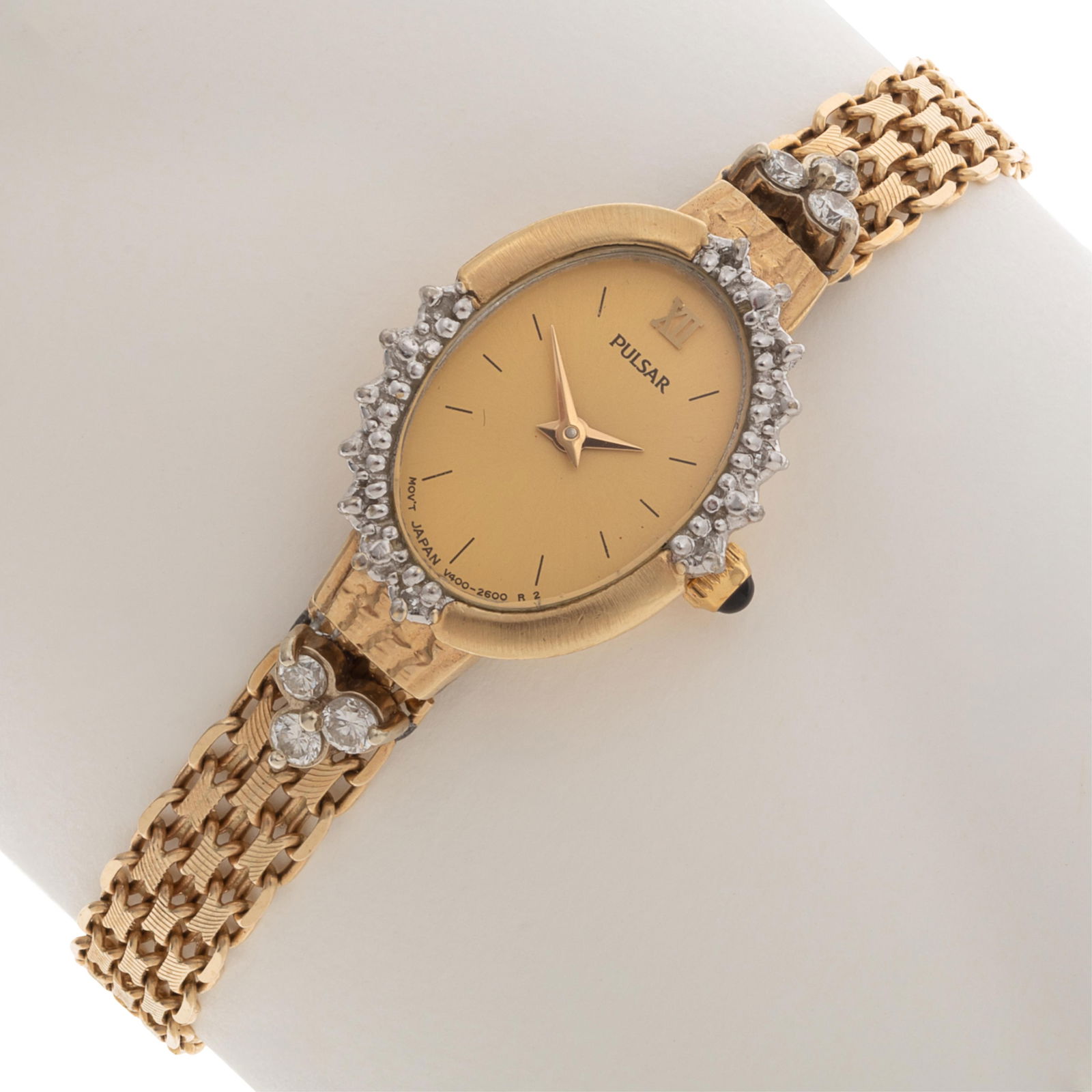 Ladies Pulsar Diamond, 14k Yellow Gold Watch: Ladies Pulsar Diamond, 14k Yellow Gold WatchDIAL: Oval, gold, applied Roman numeral at 12 o'clock with black stick hour markers, gold dauphine hands, Pulsar.MOVEMENT: Quartz (Japan V400-2600 R 2).CASE