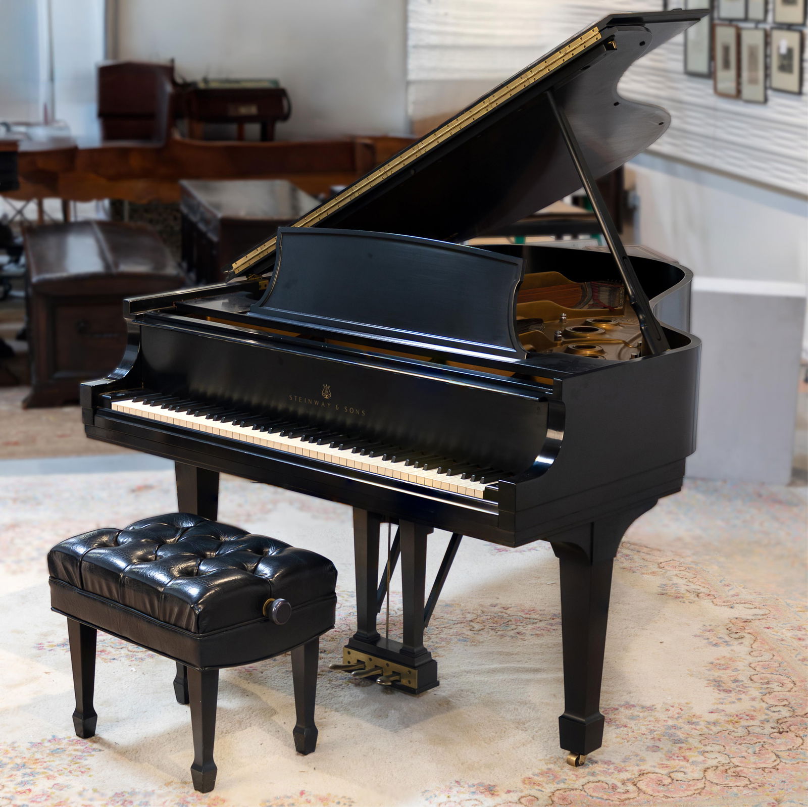 Steinway Model L Grand Piano: Steinway Model L Grand PianoSerial no. 428330Circa 1972The case with a black lacquer finish.30in (76cm) h. 5 ft. 10 1/2in (179cm) l. 58 in (148cm) w.Together with a black tufted upholstered bench.Asse