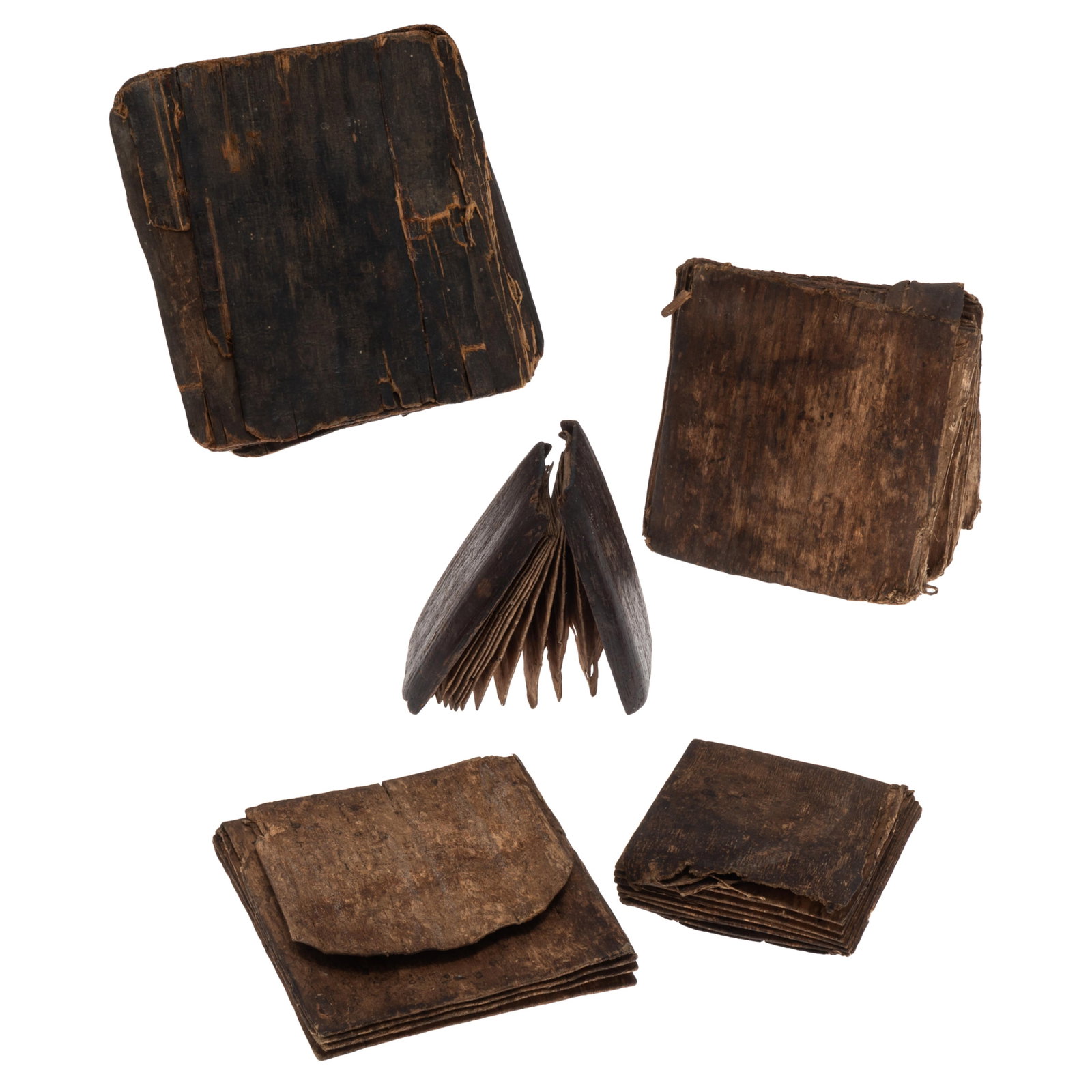 Pustaha Manuscripts from Sumatra: Pustaha Manuscripts from Sumatra A Collection of five, each with a hard cover and soft park pages. Sizes: Smallest 2in. x 4in (5cm x 10cm) to the largest 6in. x 6in (15cm x 15cm) Condition: Some deter