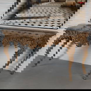 Italian Rococo Console Table: Italian Rococo Console TableThe arbalette breccia marble top above a recessed frieze carved as feathered palms on a lattice ground raised on cabriole legs carved with acanthus sending in coven hoof fe