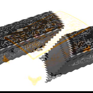 Napoleon III Ebonized Table Box: Napoleon III Ebonized Table BoxMid 19th CenturyIn the Regence taste, the foliate gilt banded ebonized box decorated with gilt acanthus issuing foliate scrolls joined by coral and cobalt highlights, op