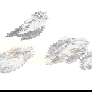 Steuben and Baccarat Glass Frogs: Steuben and Baccarat Glass FrogsTwo Steuben and one Baccarat clear glass frogs, all in a crouching posture.3in (8cm) h.4in (11cm) l.