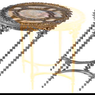 Louis XVI Style Gilt and Porcelain Center Table: Louis XVI Style Gilt and Porcelain Center TableThe gilt table centering a Sevres style porcelain plaque depicting the Muse of music, Euterpe, reclining in a floral bower with putti and a lyre within a