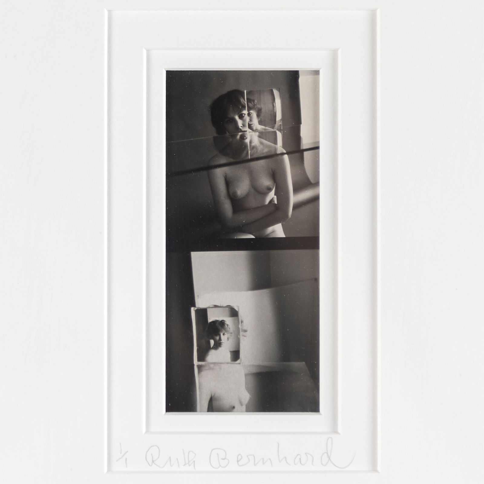 Ruth Bernhard (American, 1905-2006): Ruth Bernhard (American, 1905-2006)Nude Reflections, circa 1971Gelatin silver print, printed later, signed and numbered '1/1' in pencil on the mount4 1/4in. x 2in (11cm. x 5cm)Framed: 15in. x 12in (39