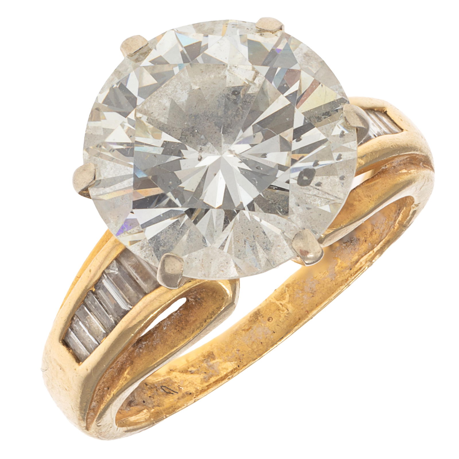 Diamond, 18k Yellow Gold Ring: Diamond, 18k Yellow Gold RingFeaturing a round brilliant-cut diamond weighing approximately 5.25 cts., accented by fifteen baguette-cut diamonds weighing a total of approximately 0.50 cttw., set in an