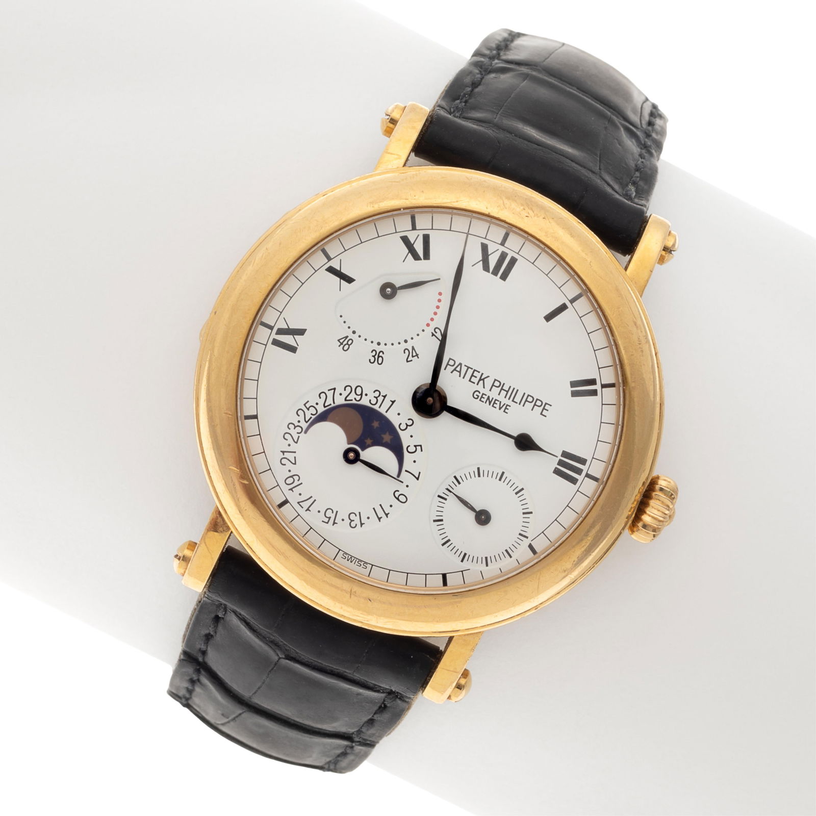 Patek Philippe, Moonphase, 18k Yellow Gold Wristwatch, Ref 5054: Patek Philippe, Moonphase, 18k Yellow Gold Wristwatch, Ref 5054DIAL: Round, white, black Roman numeral hour markers, black outer minutes track, black spade and whip hands, subsidiary small seconds dia