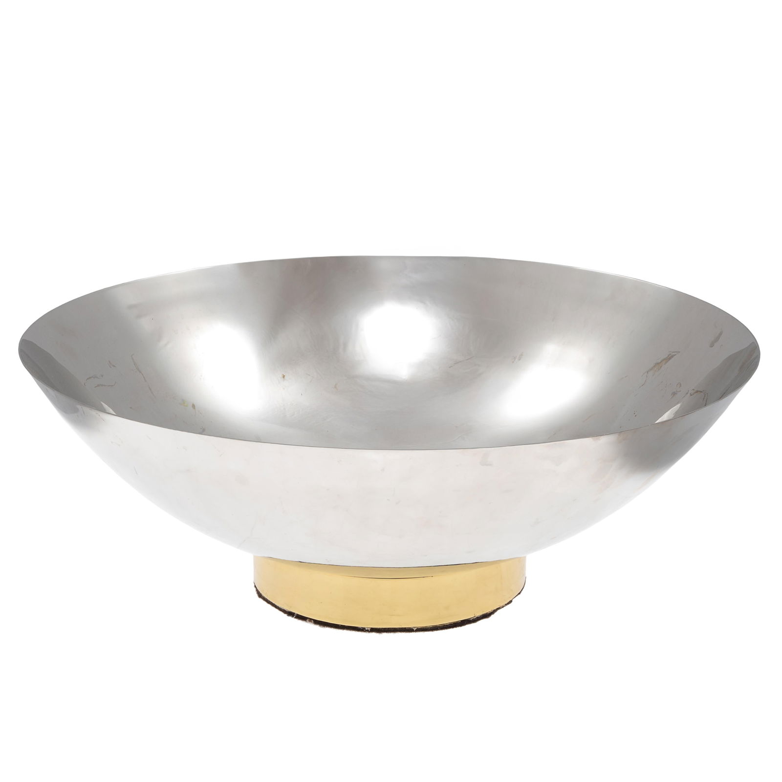 Punch Bowl in the manner or Lino Sabattini: Punch Bowl in the manner or Lino SabattiniA large silver plate ciotola da punch ending on a gilt foot.7 1/2in (19cm) h. 21in (54cm) dCondition: minor surface scratching on inside.