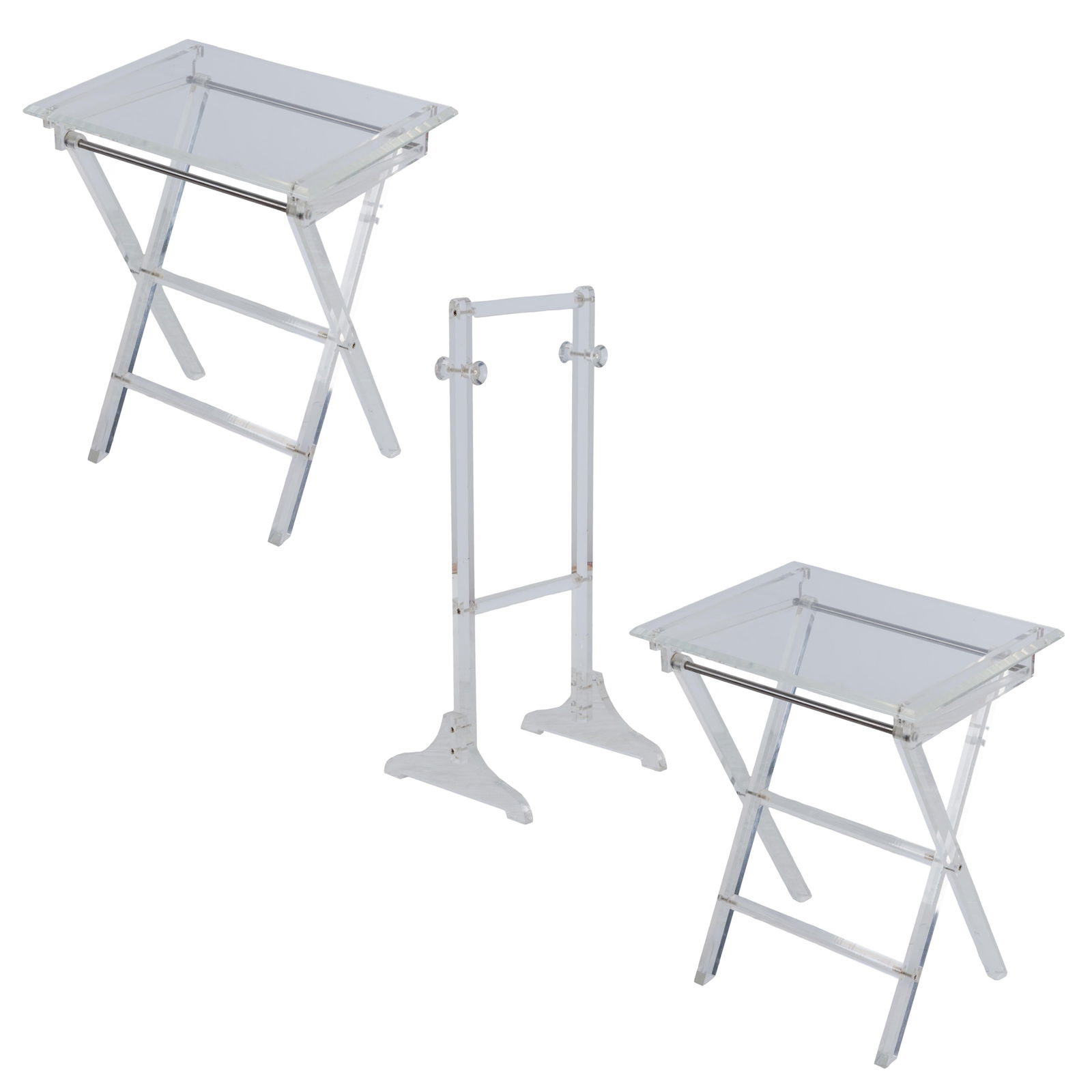 Lucite tray tables: Lucite tray tablesTwo folding tray tables opening to a X-form supports, both in fitting within a stand.Tables: 26in (66cm) h. 20in (51cm) w. 18in (46cm) dStand: 30in (76cm) h.From the former Premier A