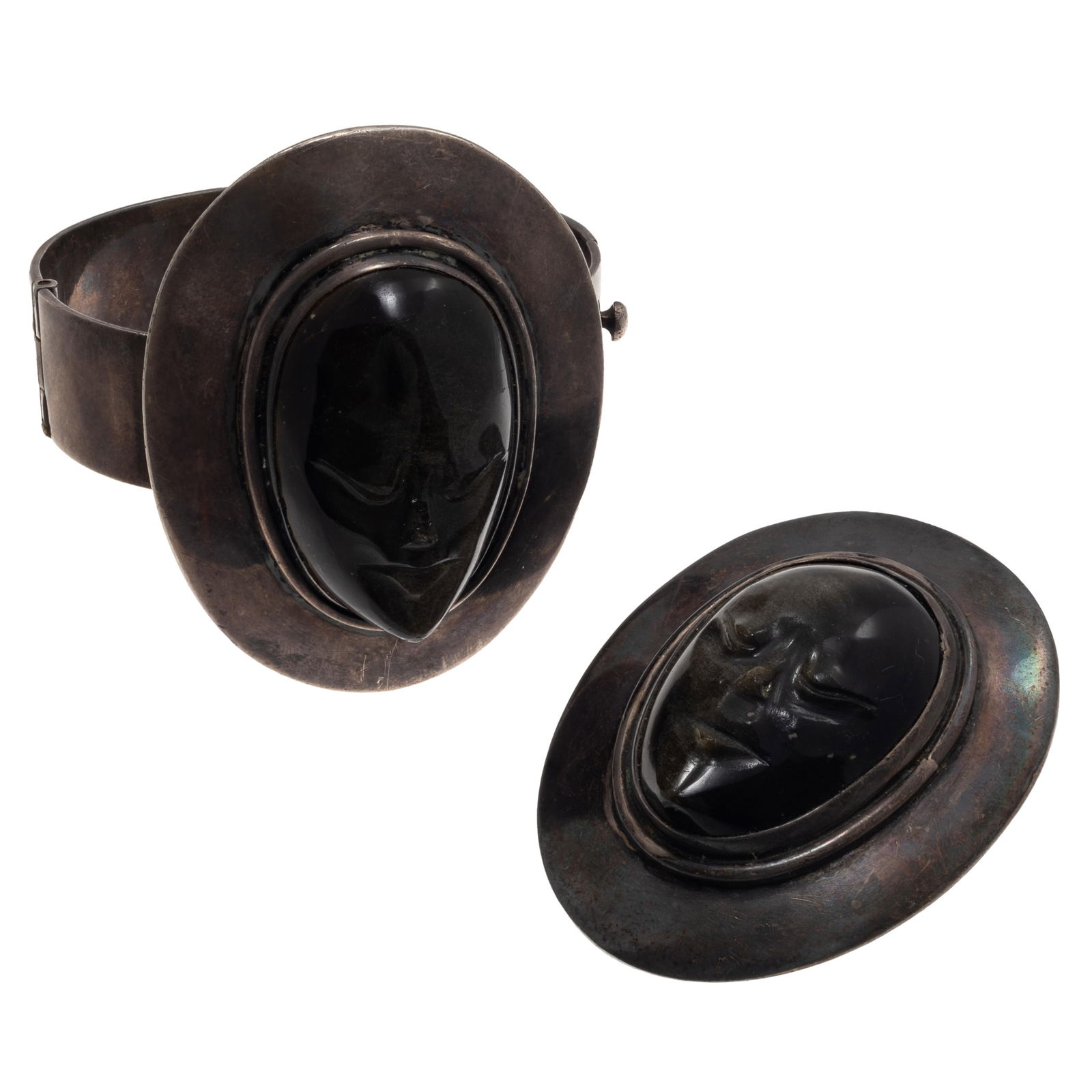 Mexican Sheen Obsidian, Sterling Silver Jewelry Suite, Los Ballesteros: Mexican Sheen Obsidian, Sterling Silver Jewelry Suite, Los BallesterosFeaturing a carved sheen obsidian mask, set in a hinged, sterling silver bracelet mounting, the top measuring approximately 2.40 x