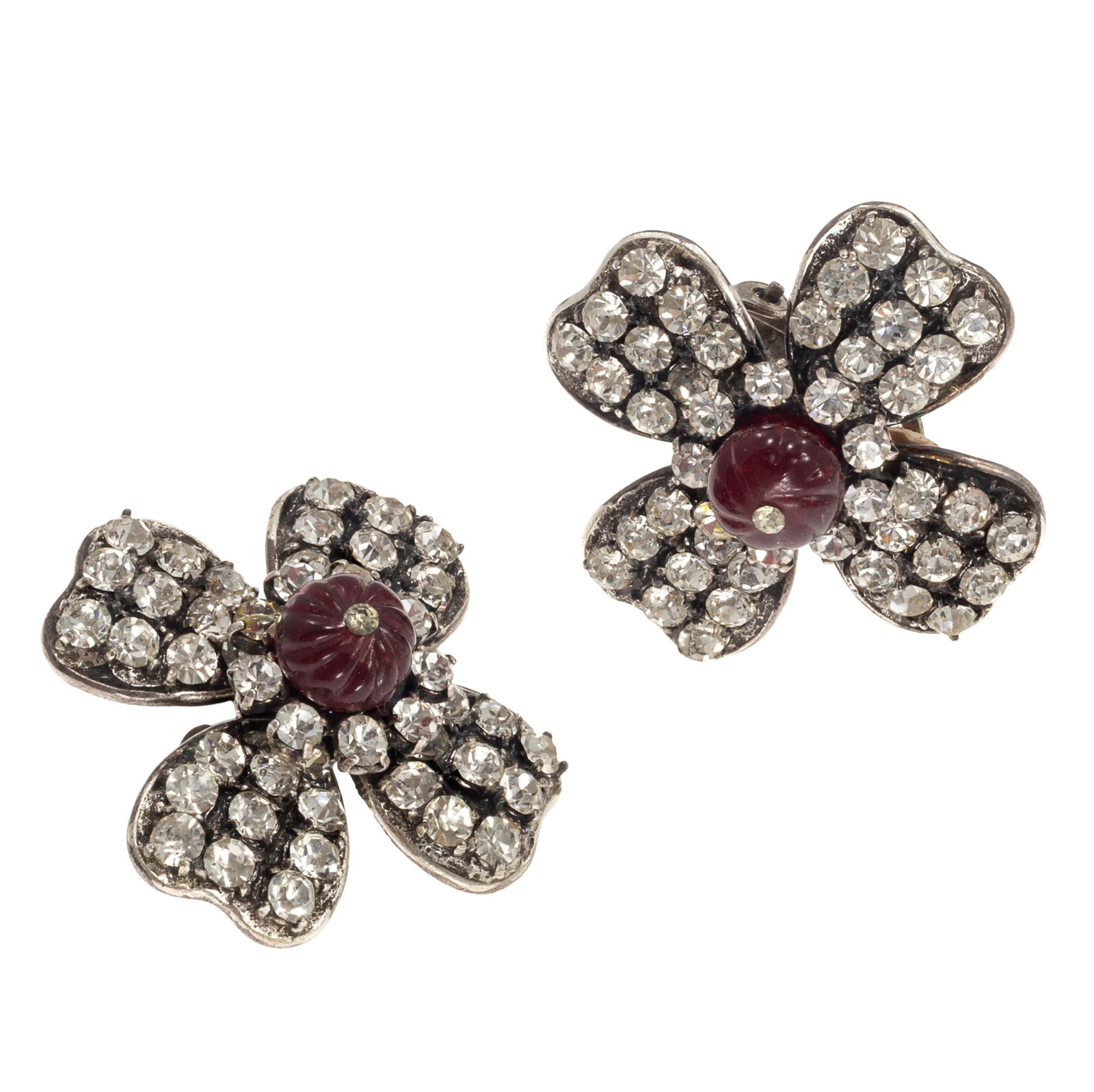 Pair of Glass, Rhinestone Ear Clips, Chanel, Autumn 1994: Pair of Glass, Rhinestone Ear Clips, Chanel, Autumn 1994Each centering circular red glass accented by colorless rhinestones, set in a silver-tone ear clip mounting measuring approximately 1.15 inches.