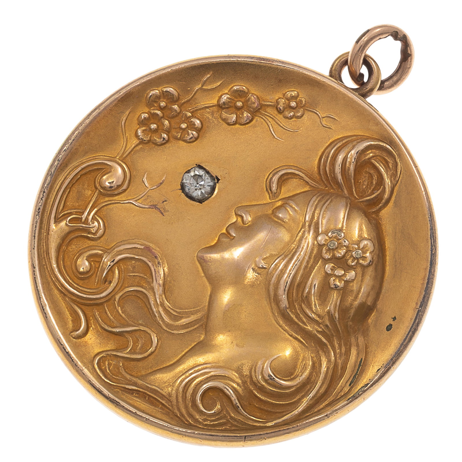 Art Nouveau 14k Yellow Gold Locket: Art Nouveau 14k Yellow Gold LocketDesigned as a repousse with sinuous hair and flowers, accented by one round-cut glass 'stone,' set in a circular locket mounting measuring approximately 1.30 inches.G
